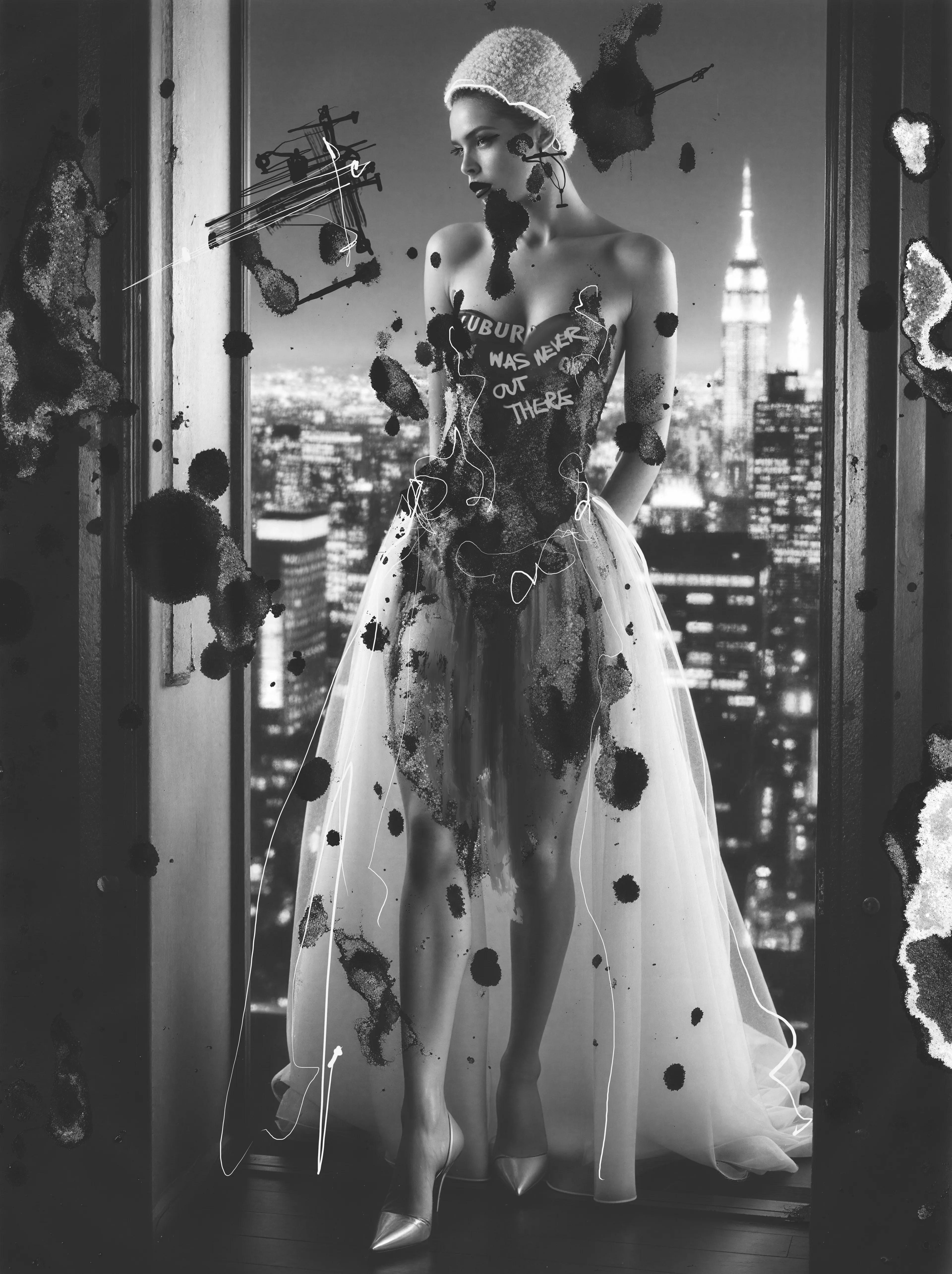 She stands in the high hush above the city, ink blooming on her like weather with a mind of its own. Suburbia Was Never Out There flickers across her chest—part warning, part spell—while New York glows beneath her like a secret she’s already survived.