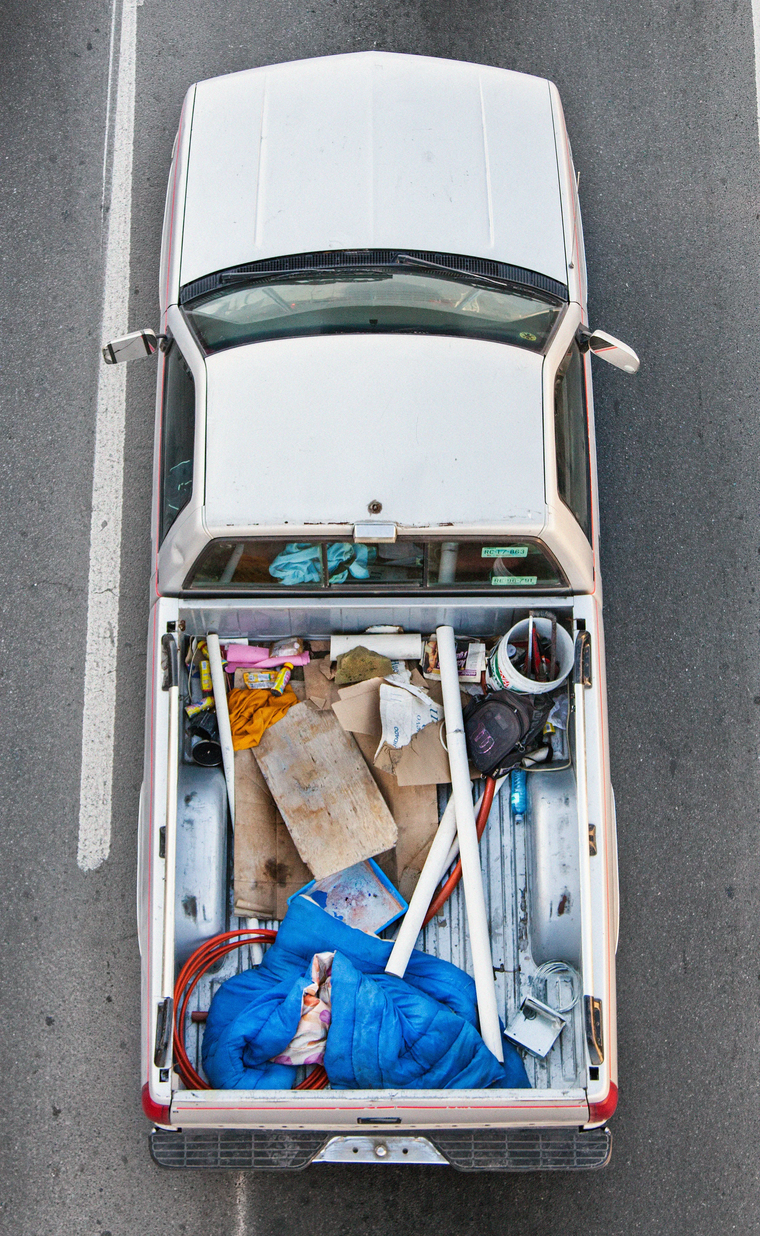 This photograph is part of my series, Carpoolers, which depicts laborers in México captured from an overpass, commuting between distant suburbs and urban centers. Like much of my work, this project comes from a desire to tell the story of the dramatic environmental, economic, and demographic changes playing out in my home city of Monterrey. This series has circulated the internet since 2011 and has been exhibited widely around the world.