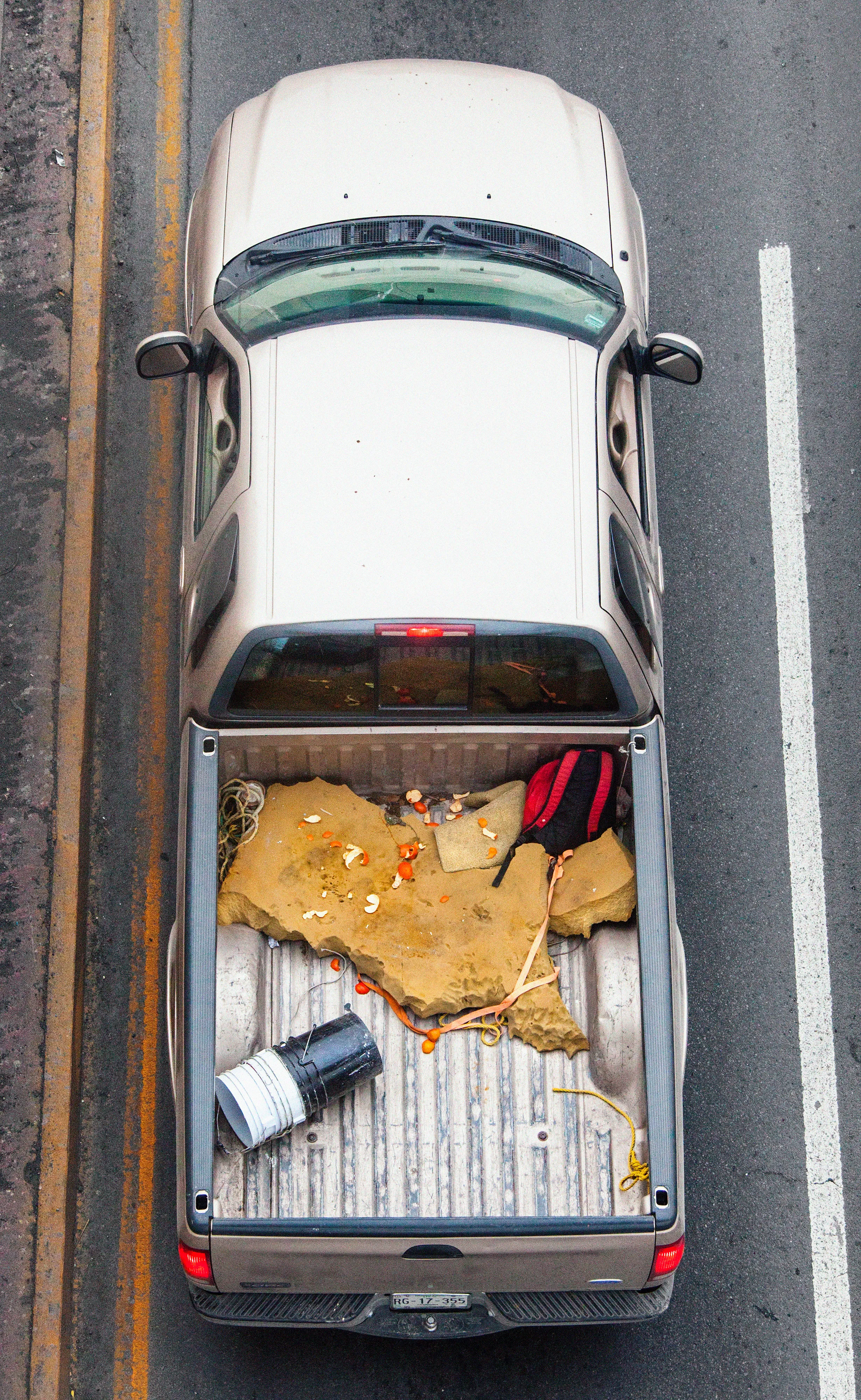 This photograph is part of my series, Carpoolers, which depicts laborers in México captured from an overpass, commuting between distant suburbs and urban centers. Like much of my work, this project comes from a desire to tell the story of the dramatic environmental, economic, and demographic changes playing out in my home city of Monterrey. This series has circulated the internet since 2011 and has been exhibited widely around the world.