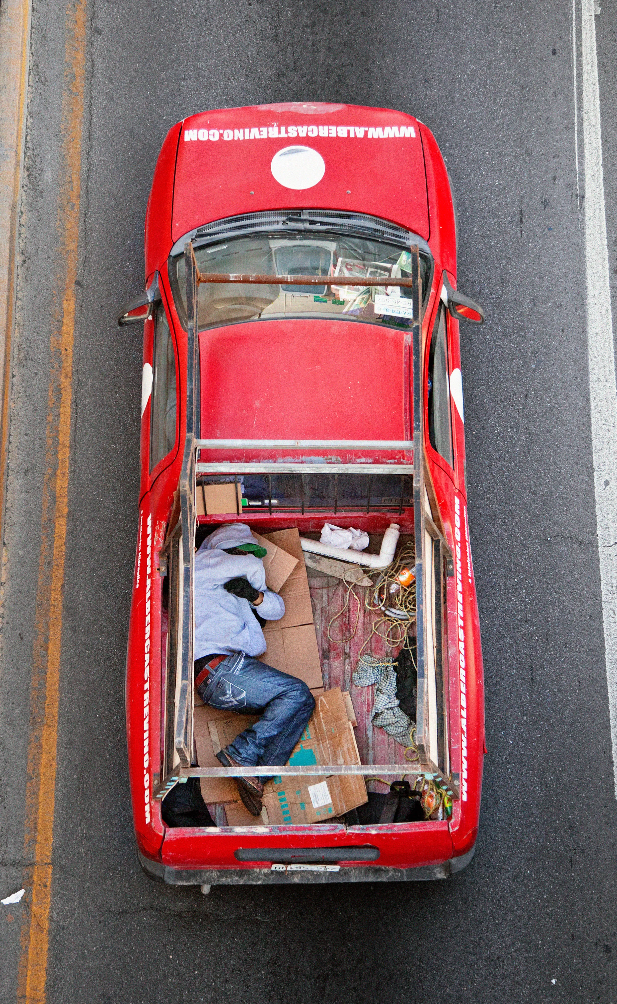 This photograph is part of my series, Carpoolers, which depicts laborers in México captured from an overpass, commuting between distant suburbs and urban centers. Like much of my work, this project comes from a desire to tell the story of the dramatic environmental, economic, and demographic changes playing out in my home city of Monterrey. This series has circulated the internet since 2011 and has been exhibited widely around the world.