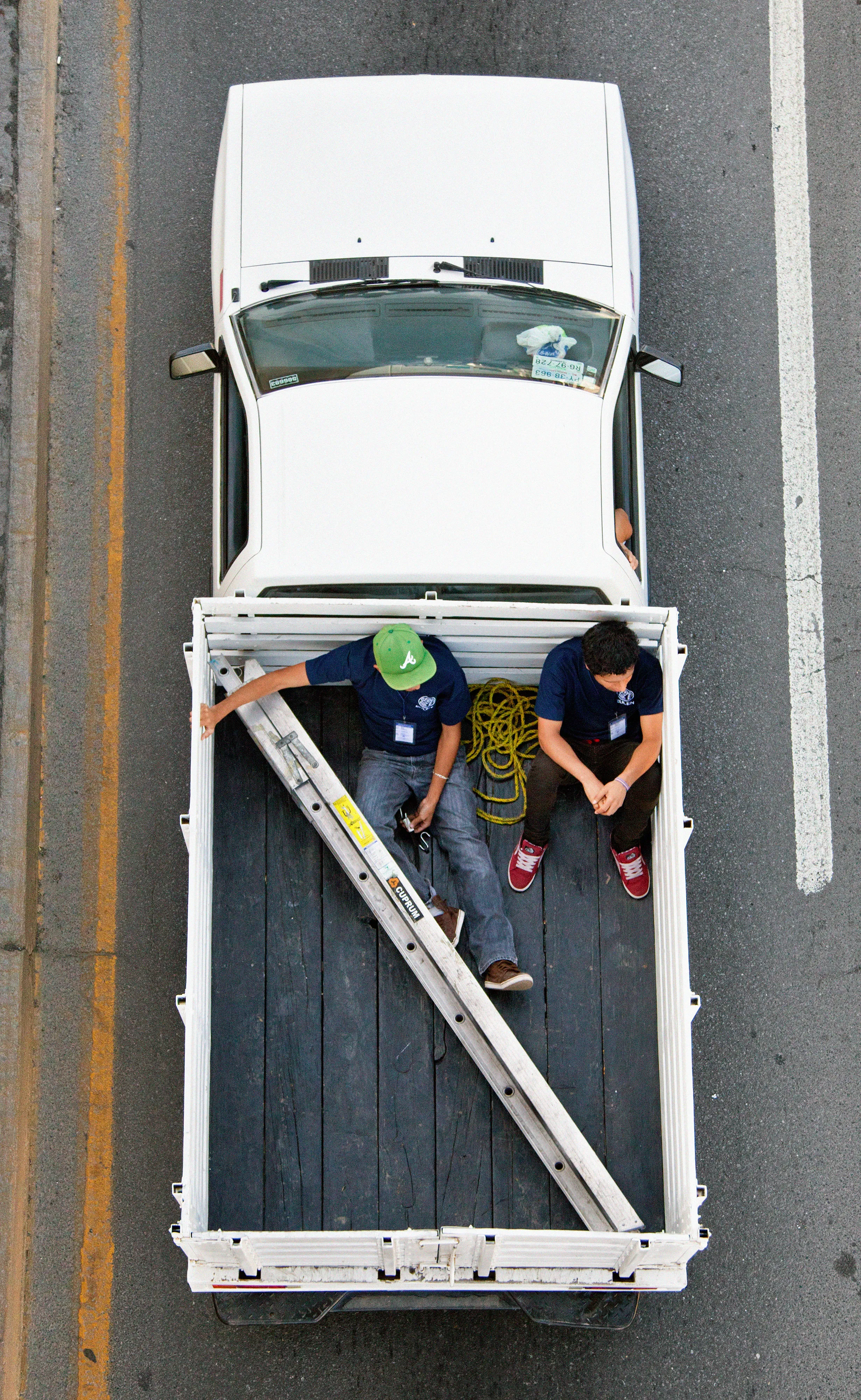 This photograph is part of my series, Carpoolers, which depicts laborers in México captured from an overpass, commuting between distant suburbs and urban centers. Like much of my work, this project comes from a desire to tell the story of the dramatic environmental, economic, and demographic changes playing out in my home city of Monterrey. This series has circulated the internet since 2011 and has been exhibited widely around the world.