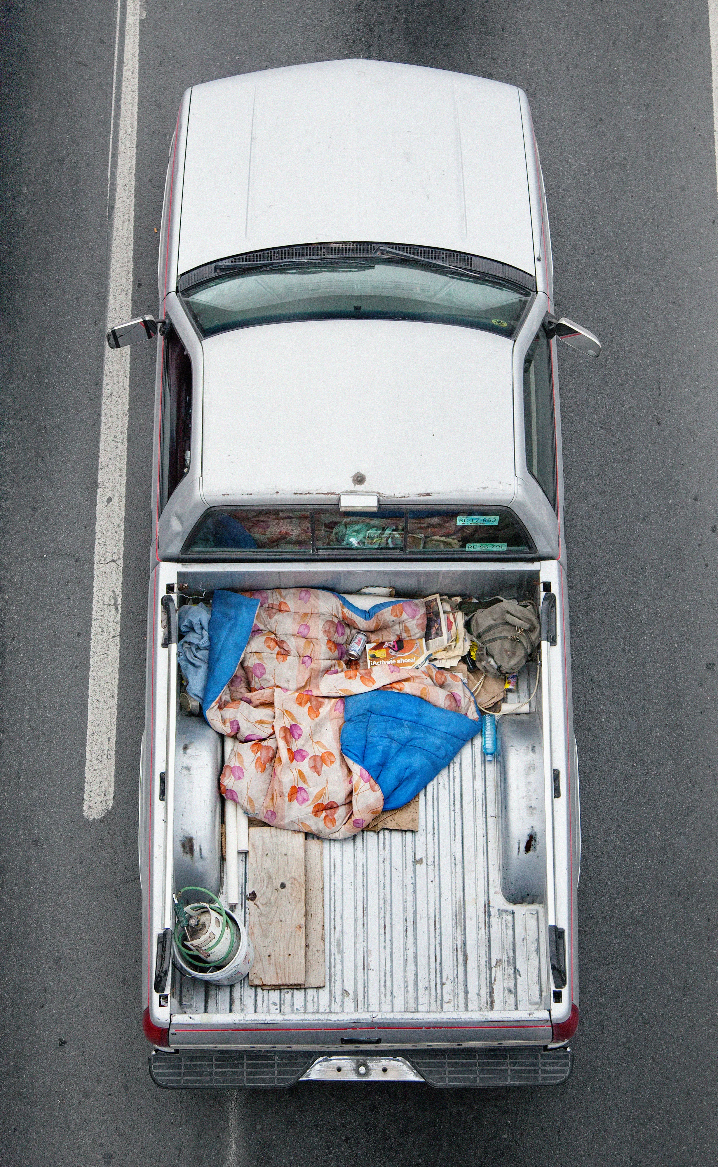 This photograph is part of my series, Carpoolers, which depicts laborers in México captured from an overpass, commuting between distant suburbs and urban centers. Like much of my work, this project comes from a desire to tell the story of the dramatic environmental, economic, and demographic changes playing out in my home city of Monterrey. This series has circulated the internet since 2011 and has been exhibited widely around the world.