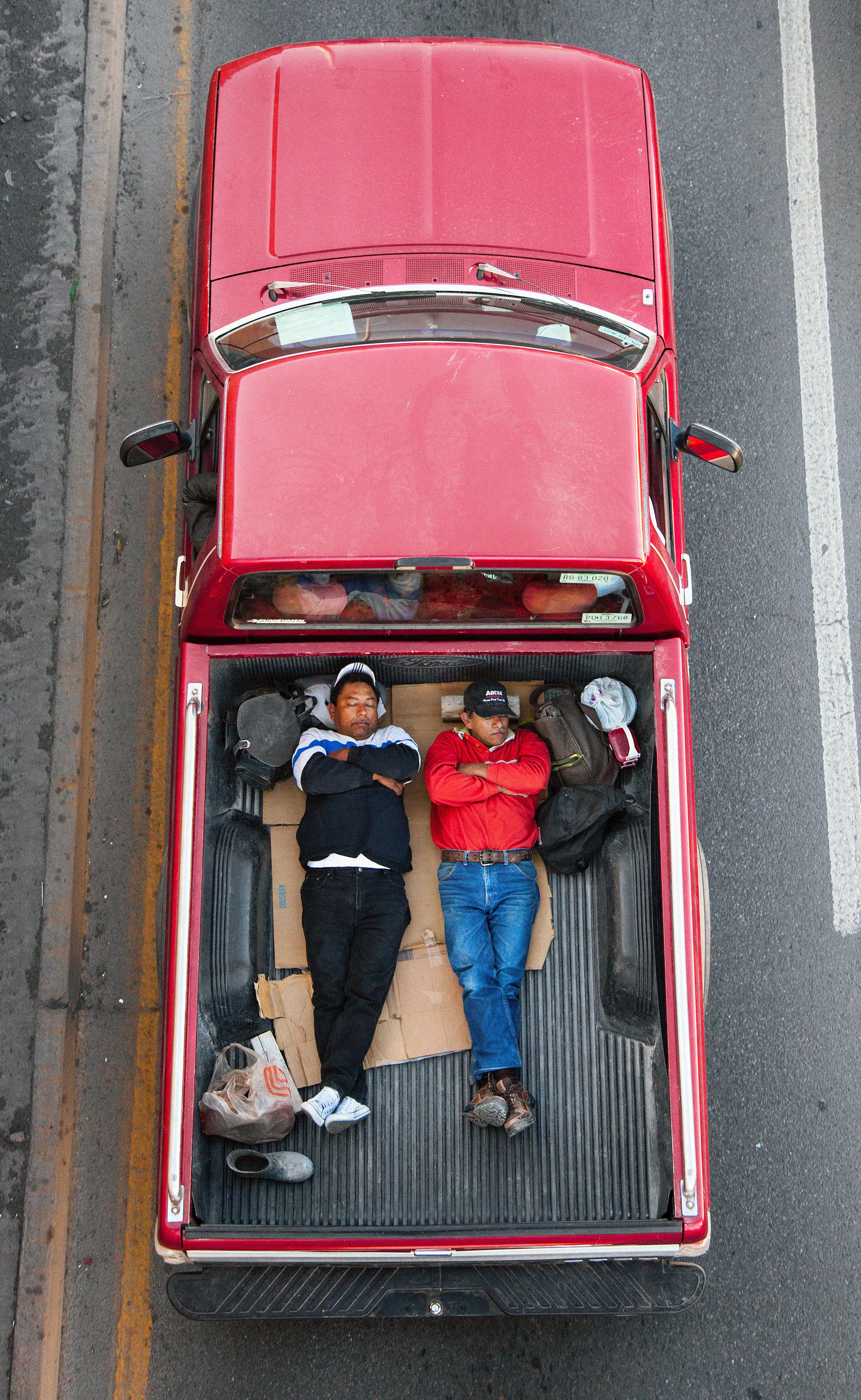 This photograph is part of my series, Carpoolers, which depicts laborers in México captured from an overpass, commuting between distant suburbs and urban centers. Like much of my work, this project comes from a desire to tell the story of the dramatic environmental, economic, and demographic changes playing out in my home city of Monterrey. This series has circulated the internet since 2011 and has been exhibited widely around the world.