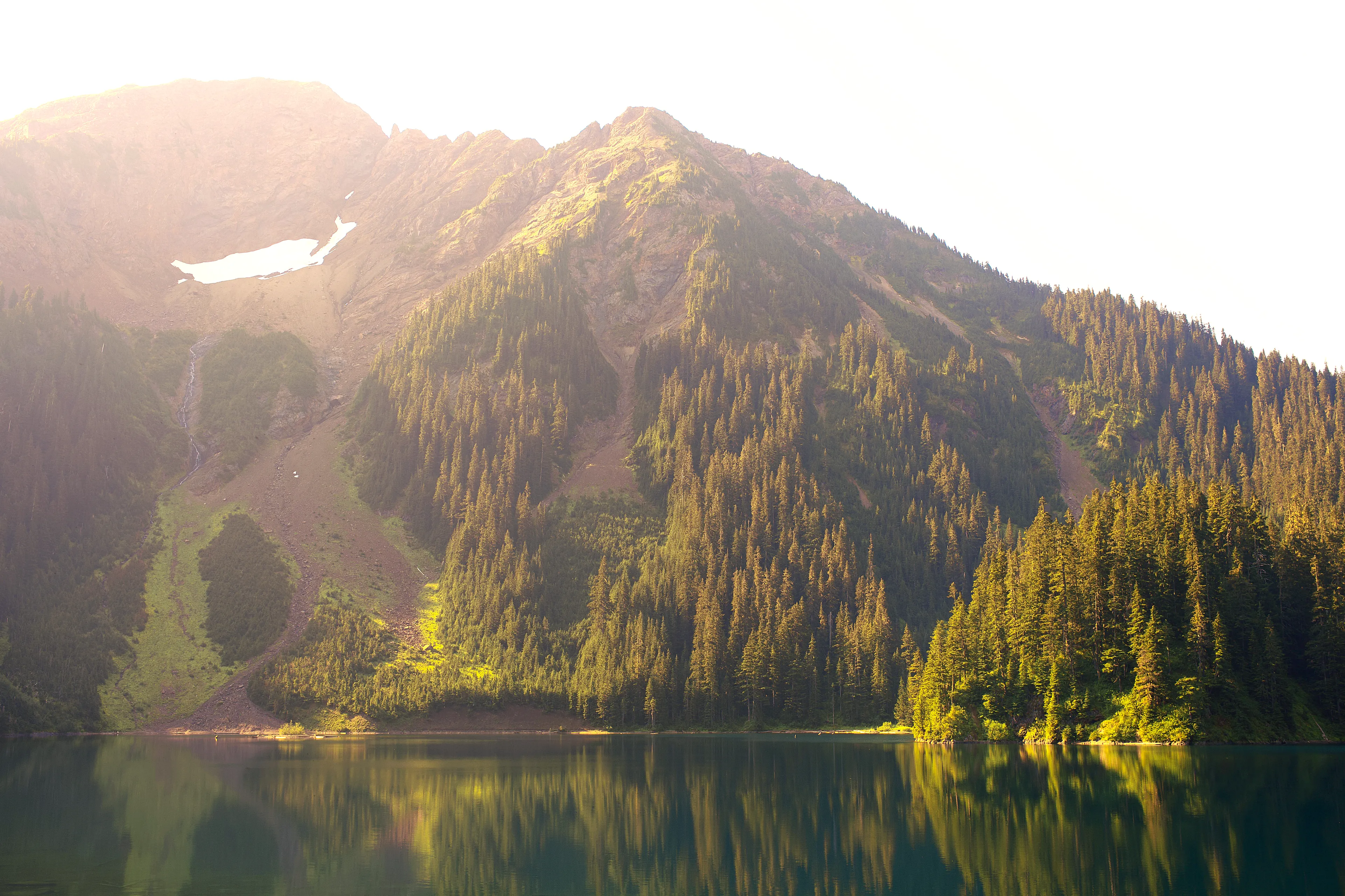 There are few things in nature that match the beauty of an pristine subalpine glacial lake in the early morning.  Lower Pearce Lake does not disappoint.  Nestled between the flanks of Mount McFarlane and Mount Pearce this alpine lake glows a stunning turquois as the first rays of the morning sunlight penetrate the cool surface.

This golden August glow is treasure certainly worth pursuing.

This image was photographed by awhurst.

Edition 1/1
