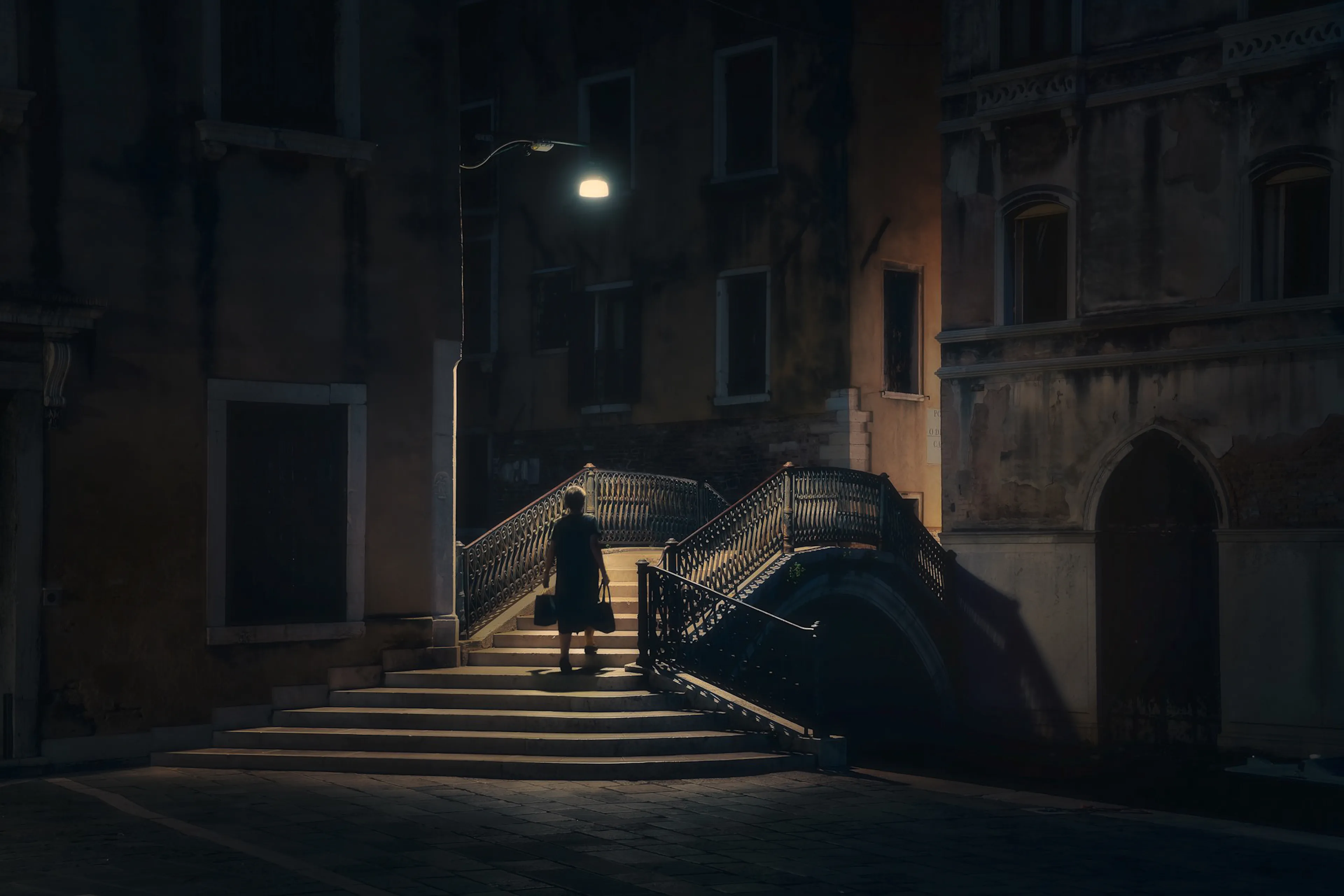 She moves forward, bringing along what cannot be left behind. In her hands, the weight of a life lived; in her heart, the weight of what it cost. The burden she bares remains, but with every step comes the hope of a new beginning.