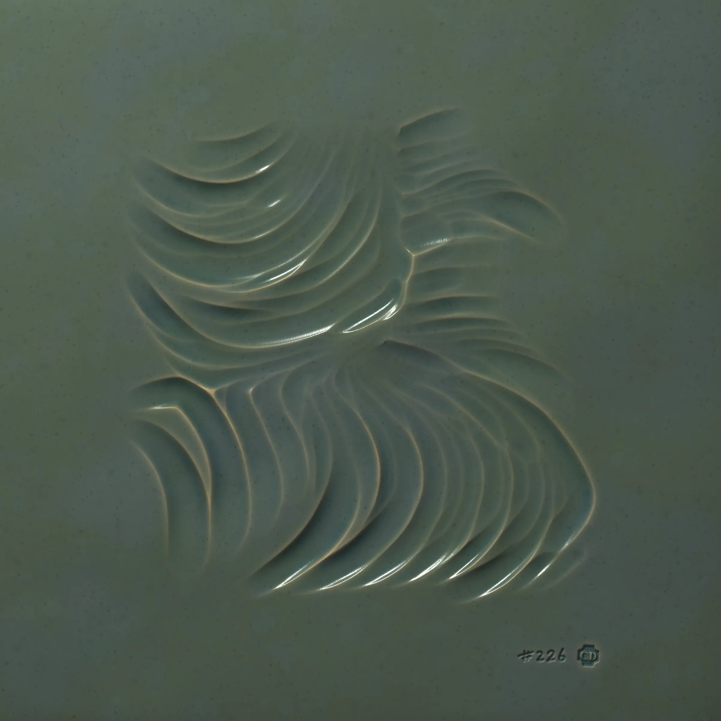 Inside the computer there’s a digital hand. The hand selects a metal implement, cuts off a slab of clay, and carves into its surface. It wanders like your hand wanders; it carves imaginary contours, sinuous and exploratory. It doesn’t know the end result so it carves lines until it feels content, and then it numbers the piece and stamps its maker’s mark. It fires the slab in a digital kiln (it calls this “minting”) and through this act its art is preserved for millennia. The hand runs its fingers over the textured surface, feeling satisfaction at having spontaneously produced a piece of art so beautiful, expressive, and unique.

---
 
Ceramics is a generative sculpture that mimics the physical expression of carving into clay. Through uncanny naturalistic rendering it challenges our notion of “handmade”. It asserts that the value of handmade isn’t the time it takes to make the work nor the physical materials consumed, but the endless small decisions and serendipitous details that appear along the way, as can be felt in each Ceramics mint.

Despite the handmade nature of Ceramics the outputs cannot be touched. Highly tactile images enchant the viewer to imagine their tangible representations, and leave them to dwell on their perception of materiality — both in the experiential physical world and conceptually-infinite digital space.