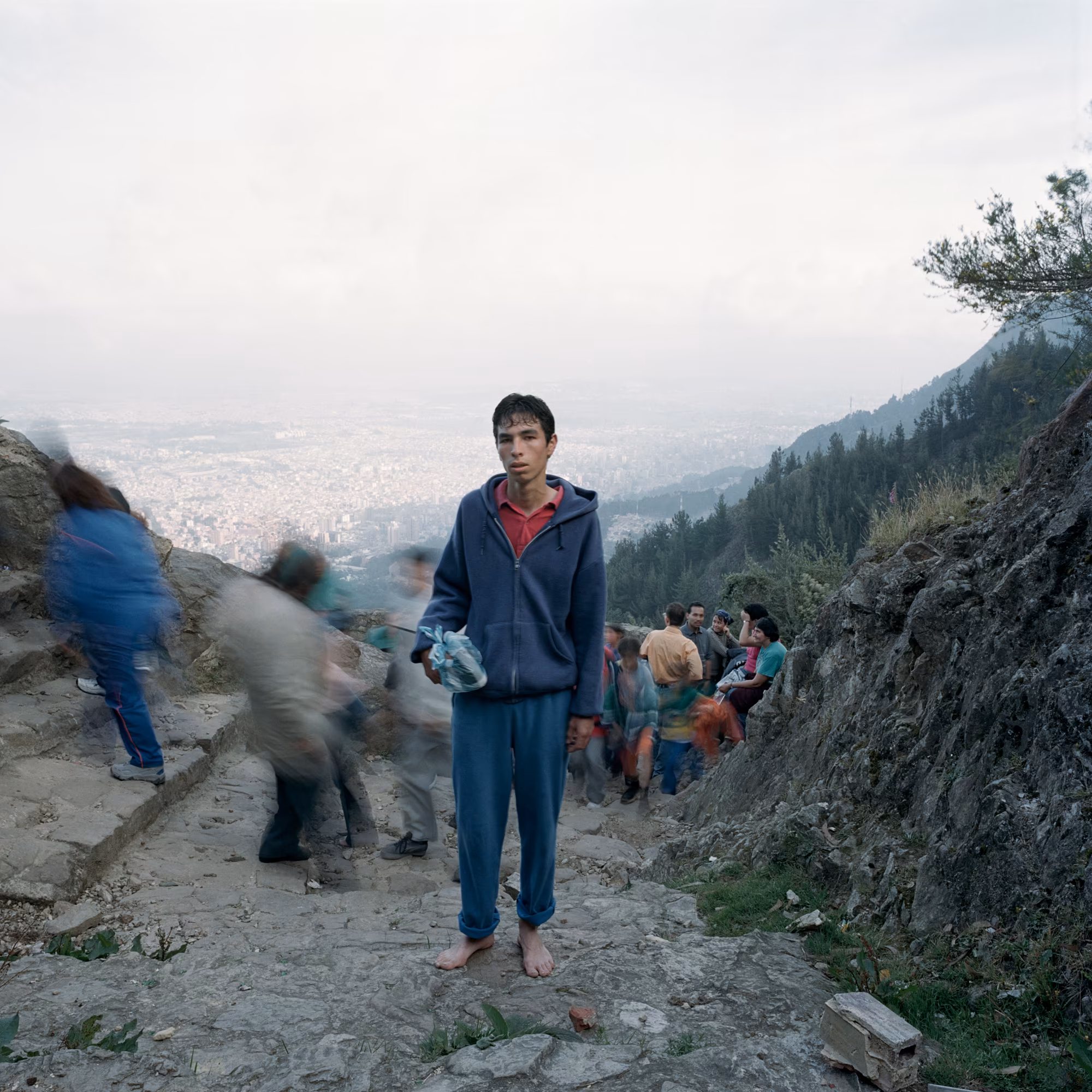 Assembly presents *Dog Days, Bogotá*, by award-winning Magnum photographer, Alec Soth. Rendered in his iconic style merging a documentary approach with a poetic sensibility, this project, one of his most personal to date, was made in Colombia during the adoption process of his daughter. In a book filled with letters, photos, and poems, he found a note his daughter’s birth mother wrote to her: “I hope that the hardness of the world will not hurt your sensitivity. When I think about you I hope that your life is full of beautiful things." These words became Soth’s mission statement as he set out to make his own book of the city of her birth describing the beauty found in a hard place. One of his earliest projects, it is minted here as his genesis NFT collection. Soth is one of the most celebrated American photographers and his work is in the collections of major museums worldwide including MoMA, The Whitney Museum of American Art, and the LA County Museum of Art.