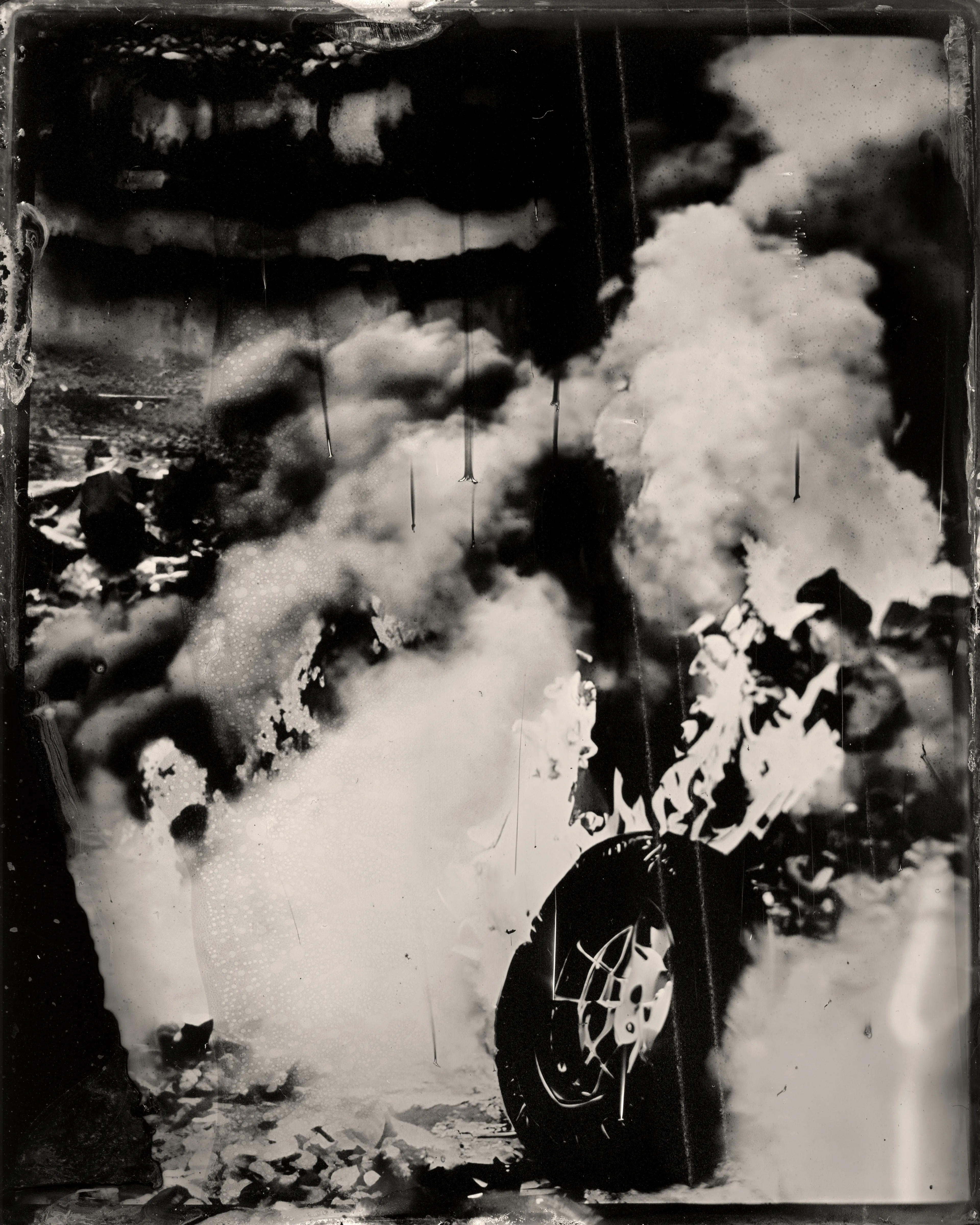 Data in silver on black metal. AI is combined with the darkroom photography technique of Wet Plate Collodion, one of the earliest forms of chemical photography ever discovered in the 1850’s.  
----  
Smoke 'Em Out  
Erika Weitz  
1/1  
2023