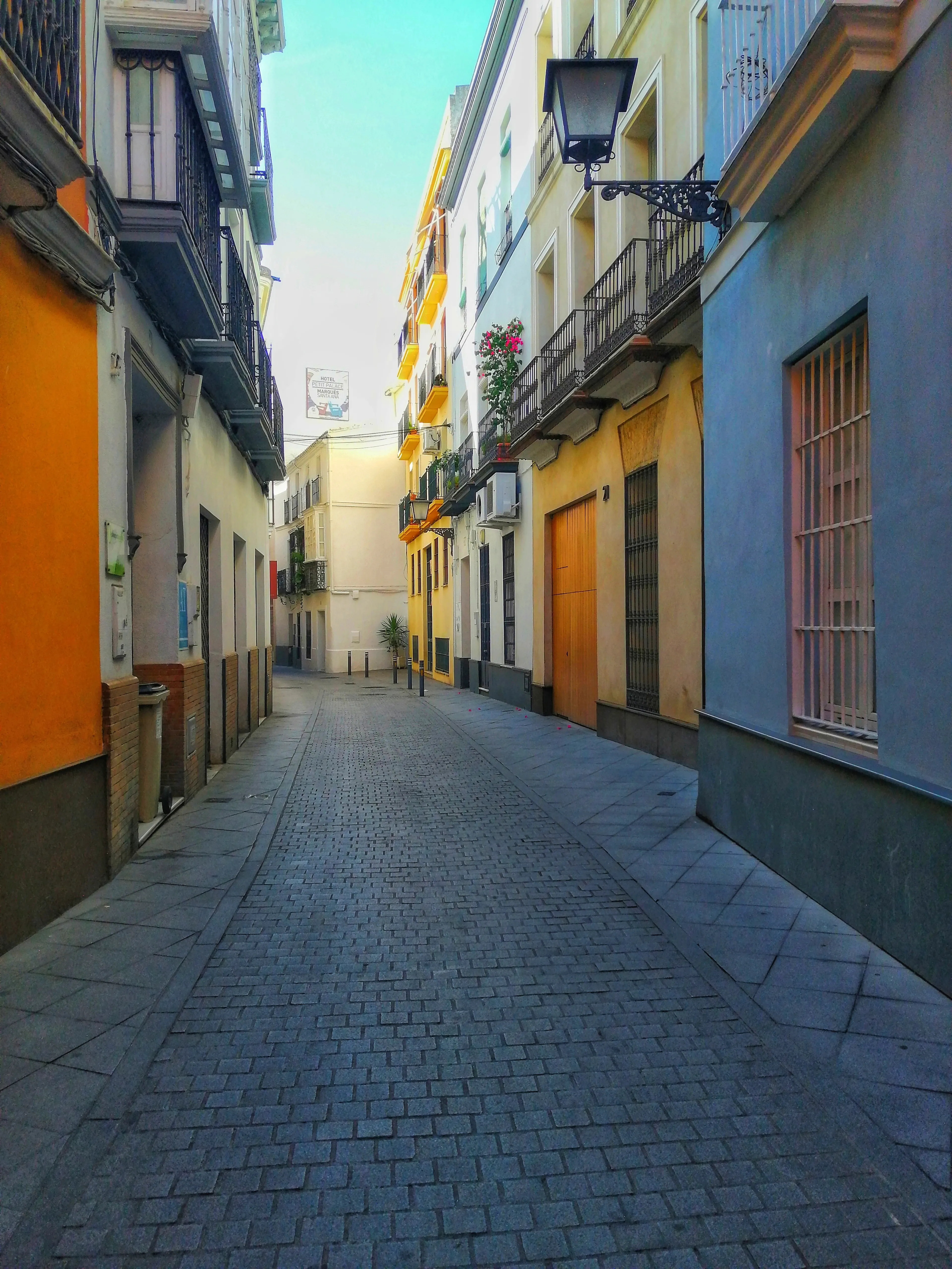 The third photograph of the Colors of Seville Collection. It is a 3840x5120 pixels color image, taken in a Seville street, edited, in which some of the elements stand out deliberately. It is a unique copy. **Colors of Seville** Collection. 6 photographs taken on the streets of Seville, Spain. 4 separated editions, limited to 6666 1/1 NFTs, minted using an ERC721 smart contract on the Ethereum blockchain. Collection migrated from Polygon POS (Chain ID **137**), first to Polygon ZkEVM (Chain ID **1101**) in March 2024 and then to Ethereum (Chain ID **1**) in February 2025. In September 2025, the collection has been migrated to the second version of NFTs on Ethereum. Same photos, but improved NFTs with the correction of minting errors; The **image** field was added to the metadata and the **properties** field was changed to **attributes** to comply with the ERC721 metadata standard; Addition of the Chain ID and Token ID as well as the minting date to identify the NFT on the blockchain and authenticate the artwork. Regarding the structure of the metadata: The Token ID of each NFT contains information about the edition and the photograph that certifies this NFT. Example: Token ID 2260 informs us that this is copy **2** of the Ruta al Palacio (Gold Edition). Some NFTs TokenID ends on **1** or maybe **2**. This means that the NFT has been reminted due to an error in the first mint. The erroneous NFT and the previous version has been sent to the burn address (0x000000000000000000000000000000000000dEaD).   **Important Recommendation**: For the long-term survival of this NFT, you should keep multiple exact copies of the metadata file and the PNG file of the photo. This allows you to pin them yourself on the decentralized IPFS protocol or authenticate the NFT in case of deterioration of platform infrastructure or IPFS itself.