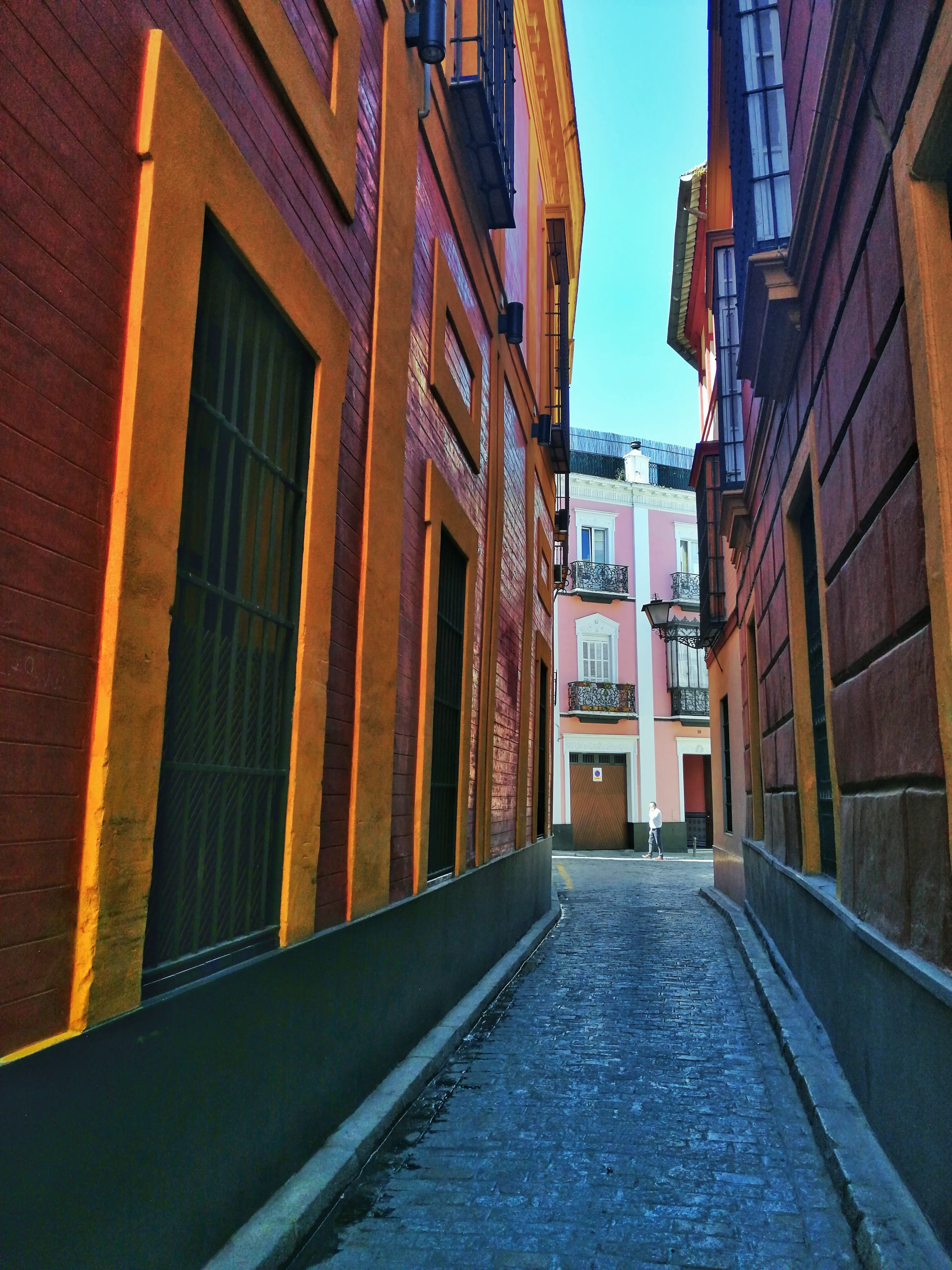 Second edition of the NFT **Pasillo de Color (Original Edition) # 1/6** with a degree of desaturation (around 25%) with respect to the original image. **Colors of Seville** Collection. 6 photographs taken on the streets of Seville, Spain. 4 separated editions, limited to 6666 1/1 NFTs, minted using an ERC721 smart contract on the Ethereum blockchain. Collection migrated from Polygon POS (Chain ID **137**), first to Polygon ZkEVM (Chain ID **1101**) in March 2024 and then to Ethereum (Chain ID **1**) in February 2025. In September 2025, the collection has been migrated to the second version of NFTs on Ethereum. Same photos, but improved NFTs with the correction of minting errors; The **image** field was added to the metadata and the **properties** field was changed to **attributes** to comply with the ERC721 metadata standard; Addition of the Chain ID and Token ID as well as the minting date to identify the NFT on the blockchain and authenticate the artwork. Regarding the structure of the metadata: The Token ID of each NFT contains information about the edition and the photograph that certifies this NFT. Example: Token ID 2260 informs us that this is copy **2** of the Ruta al Palacio (Gold Edition). Some NFTs TokenID ends on **1** or maybe **2**. This means that the NFT has been reminted due to an error in the first mint. The erroneous NFT and the previous version has been sent to the burn address (0x000000000000000000000000000000000000dEaD).   **Important Recommendation**: For the long-term survival of this NFT, you should keep multiple exact copies of the metadata file and the PNG file of the photo. This allows you to pin them yourself on the decentralized IPFS protocol or authenticate the NFT in case of deterioration of platform infrastructure or IPFS itself.