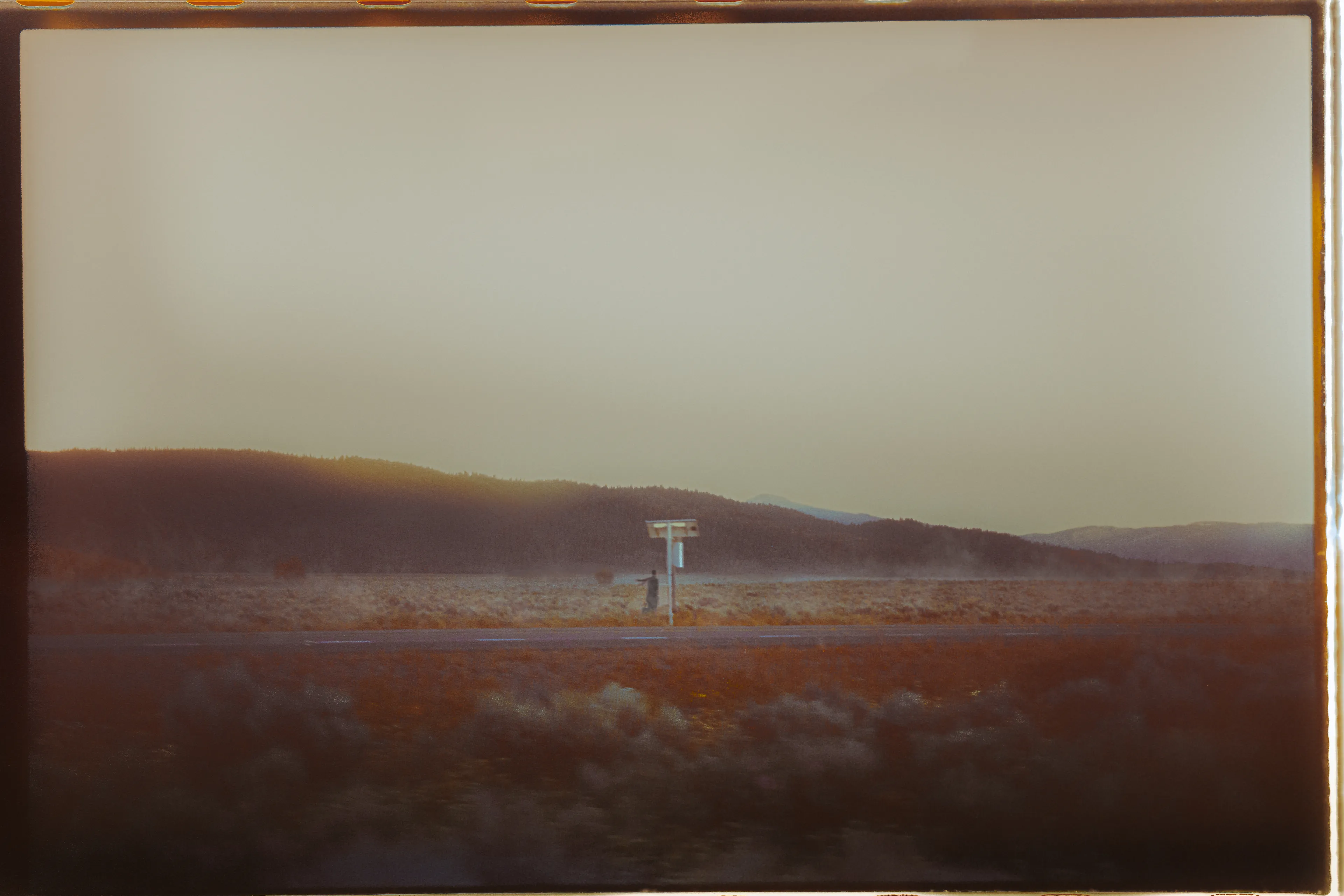 Shot on 35mm somewhere in Idaho, this image is a piece that expresses the toll of my journey through the world of being an artist and the trials I face with my recently found sobriety. I think the lone figure finding their way through a hostile terrain can be relatable to any of us, and I hope each viewer has their own unique take on the figure based on their own life experiences.