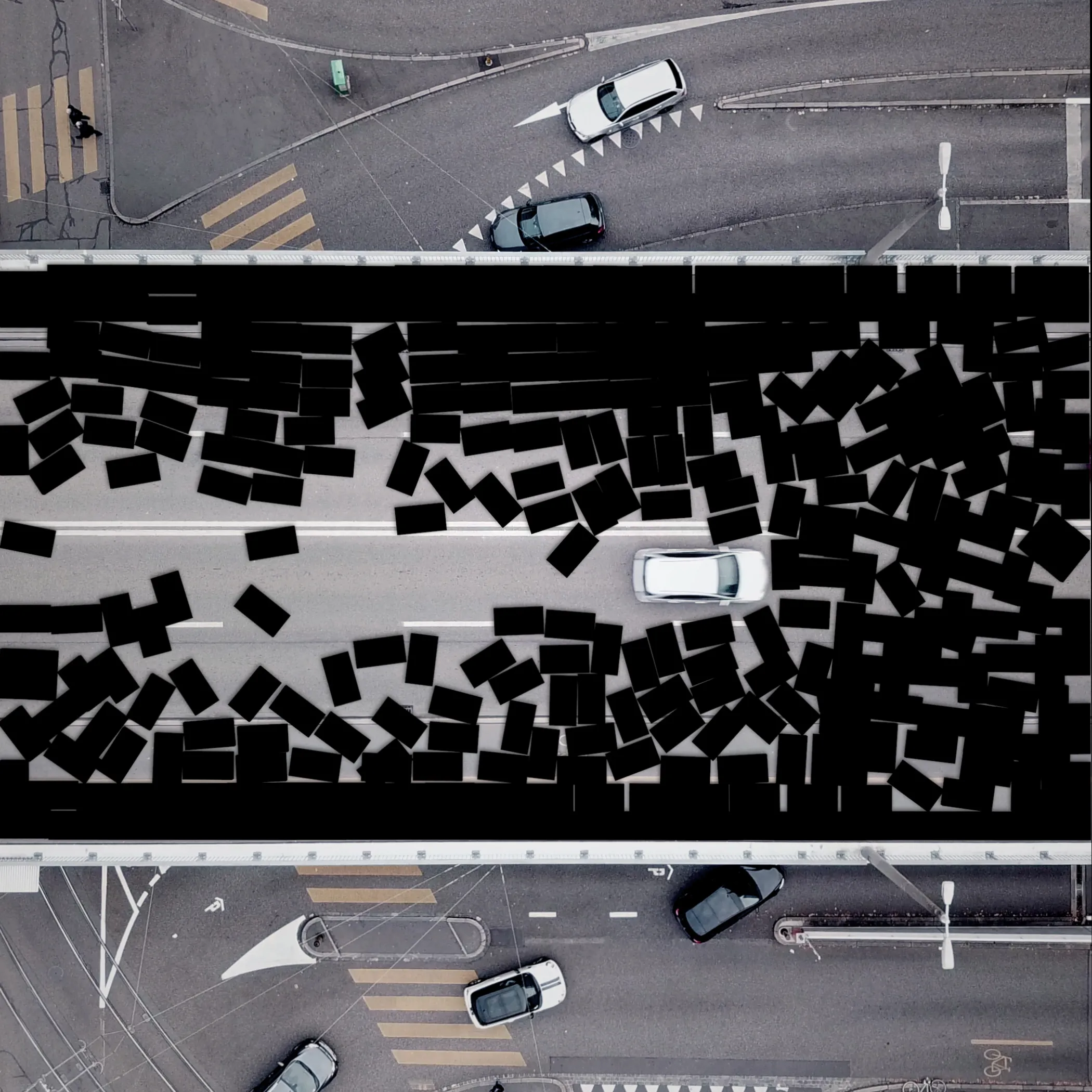 This work is part of a series which shows a place called «Heuwaage» in Basel. A Highway with driving vehicles was filmed by the use of a drone. Digital shapes were placed into the scene. The vehicles drive into the objects without braking, which results in a bizarre situation. An investigation of the interface between the real and the digital world.