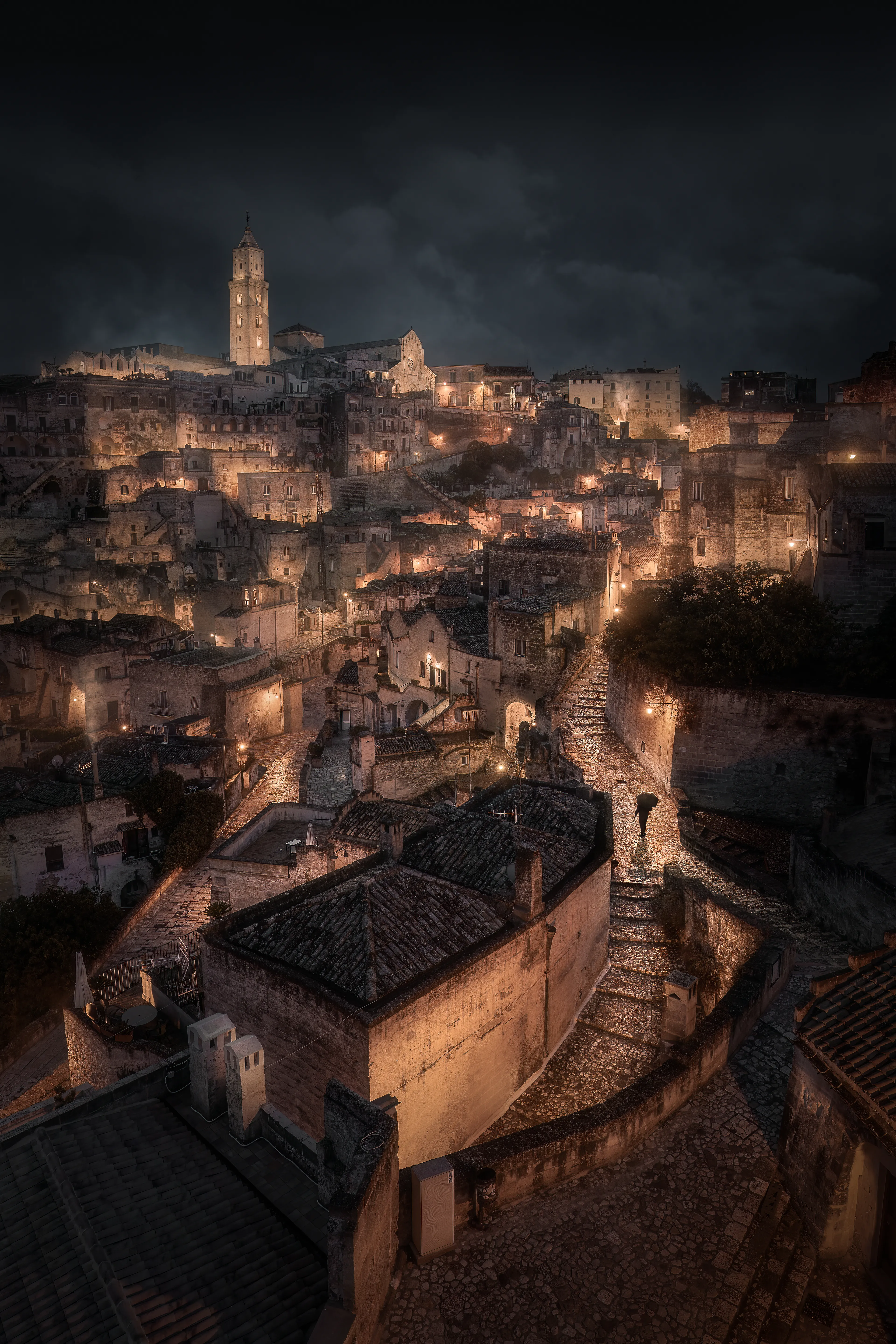 As I watched dawn break over the ancient city, I was mesmerized by what was in front of me. Matera may look like just another Italian town but its story is like no other. 

People have lived here for over 9000 years, making it the third oldest city in the world. Once referred to as the ‘Shame of Italy’, Matera has risen from its tragic, abandoned past and restored to a state befitting its ancient history and cavernous beginnings. Its story, and people, are a true testament of enduring strength and resilience.

As the lone person walked into my composition, I could almost hear him say, “this is my home, and I’m still here.”