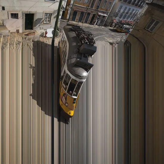 This video loop was shot in Lisboa. It shows a tram simply running on its tracks. But at one point, the tram distorts and enters some kind of digital time and space distortion.