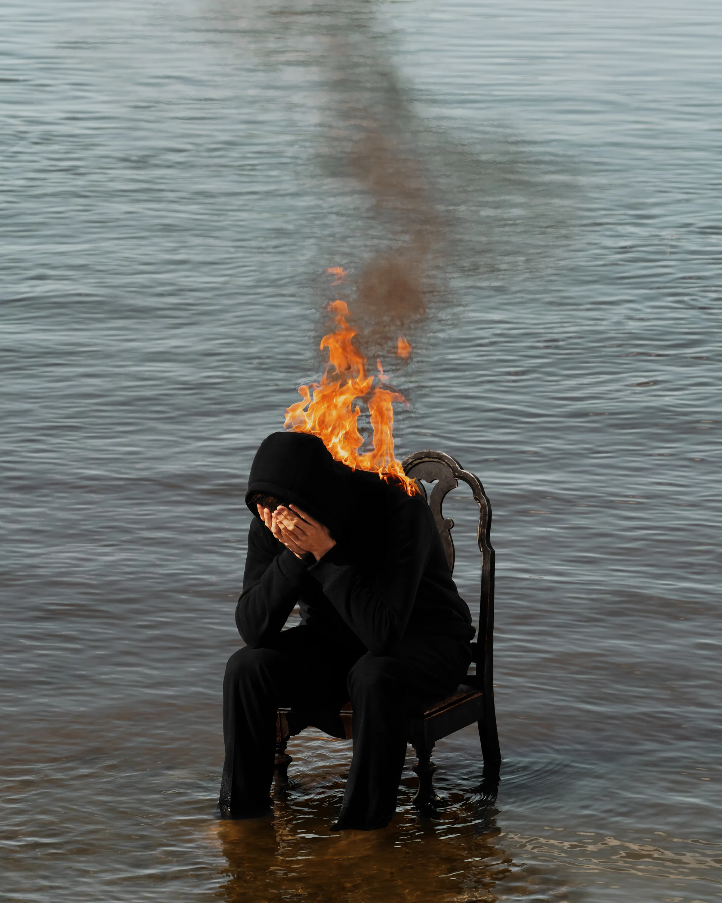 

Digital photograph, manipulated further in Photoshop.
Flames are real/shot in camera. 