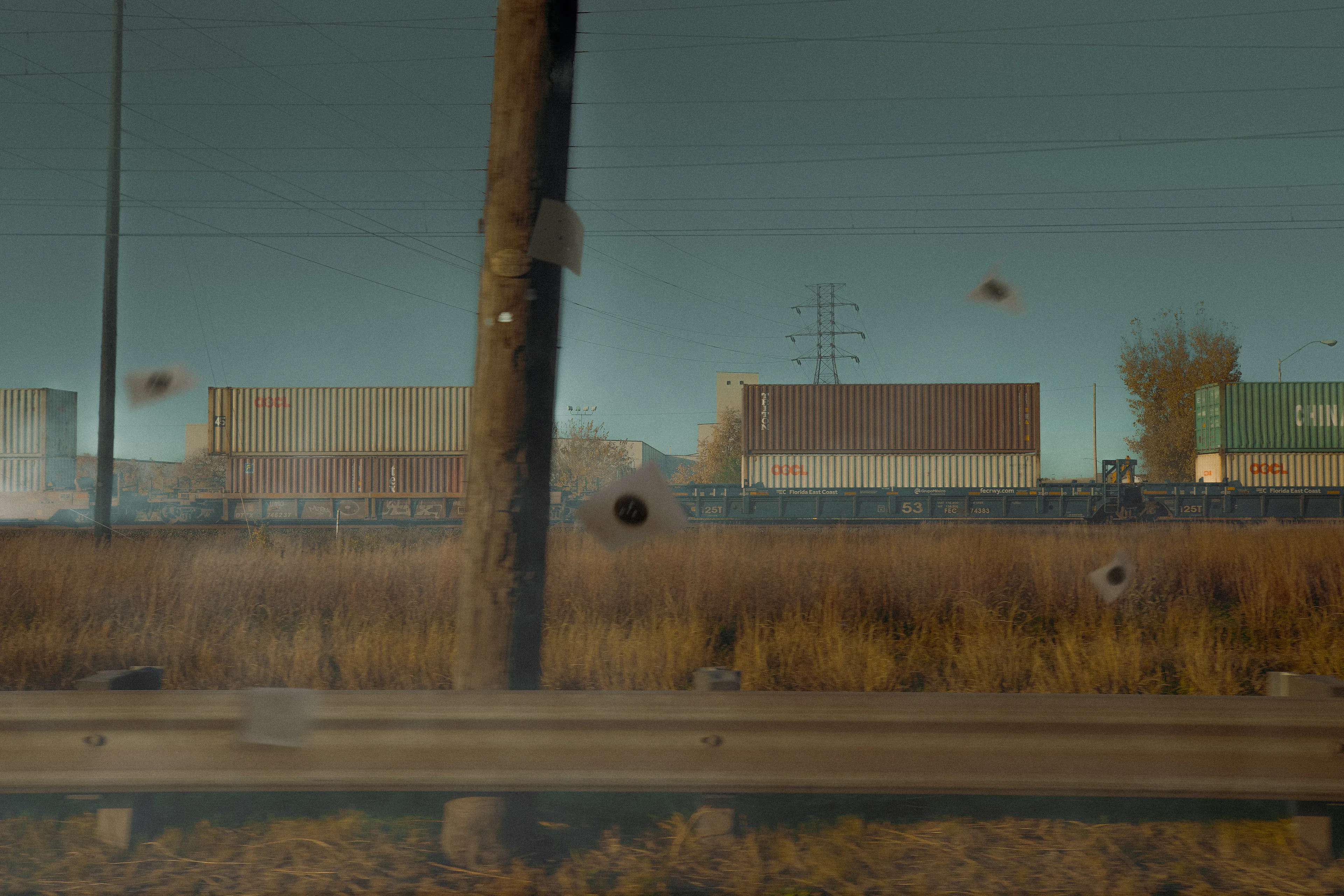 A photographic composite that uses motion and color to express the fast paces that life moves at. The targets blow in the wind, brandishing bullet holes from projectiles past. 