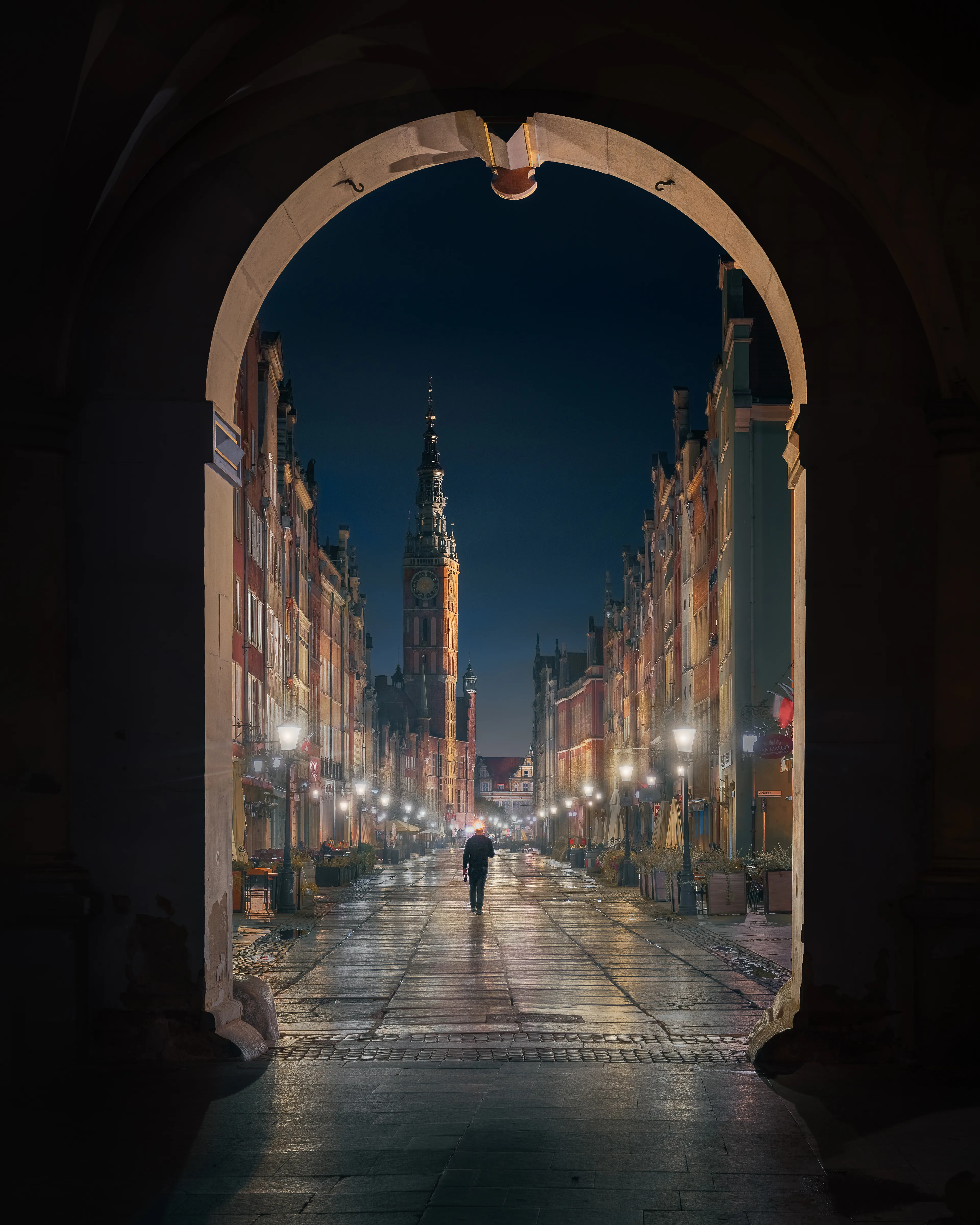 I’m often intrigued by the mysterious nature of the subjects in my images. Their unknown stories allow me to create my own narratives and project the viewer into them. While shooting this image in the streets of Gdansk, I wondered where the lone man was heading. Perhaps it’s this curiosity that draws me in and propels me to capture these enigmatic photographs.
