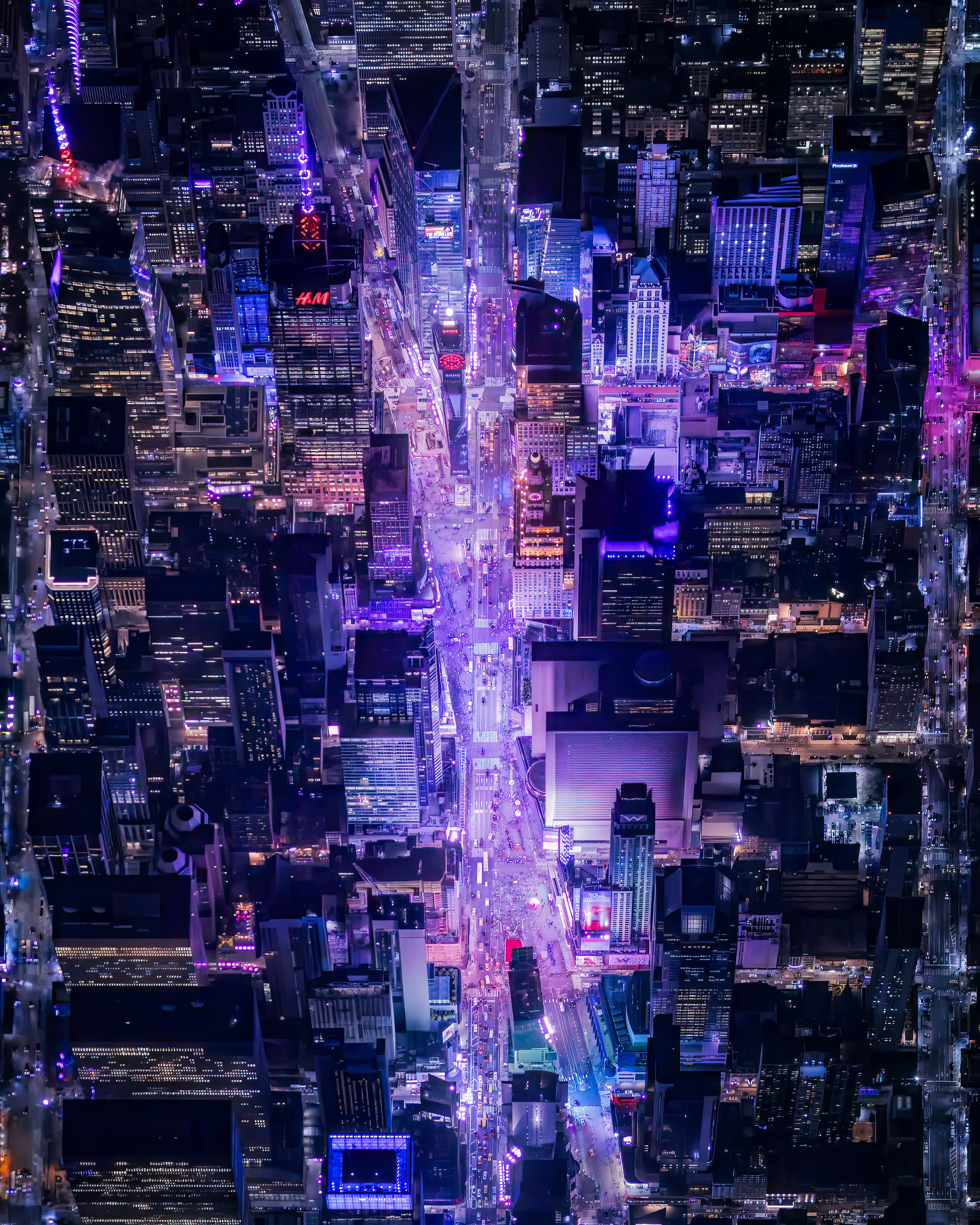 8,000 feet above the Crossroads of the World, is an amazing sight to behold.  New York  from above at night is the one time that you can actually see the movements of the city lights.  The ebb and flow of car lights, sirens, and thousands of people milling about in Times Square.  This unique view feels so intimate and yet still feels so removed. It is one the most conflicting feelings.  I am both cherishing its singular nature, and wishing everyone could witness this all at once.  Taken from an open door helicopter - the onslaught of wind, vibration, and sound demands complete focus and execution to capture a clean, focused image.