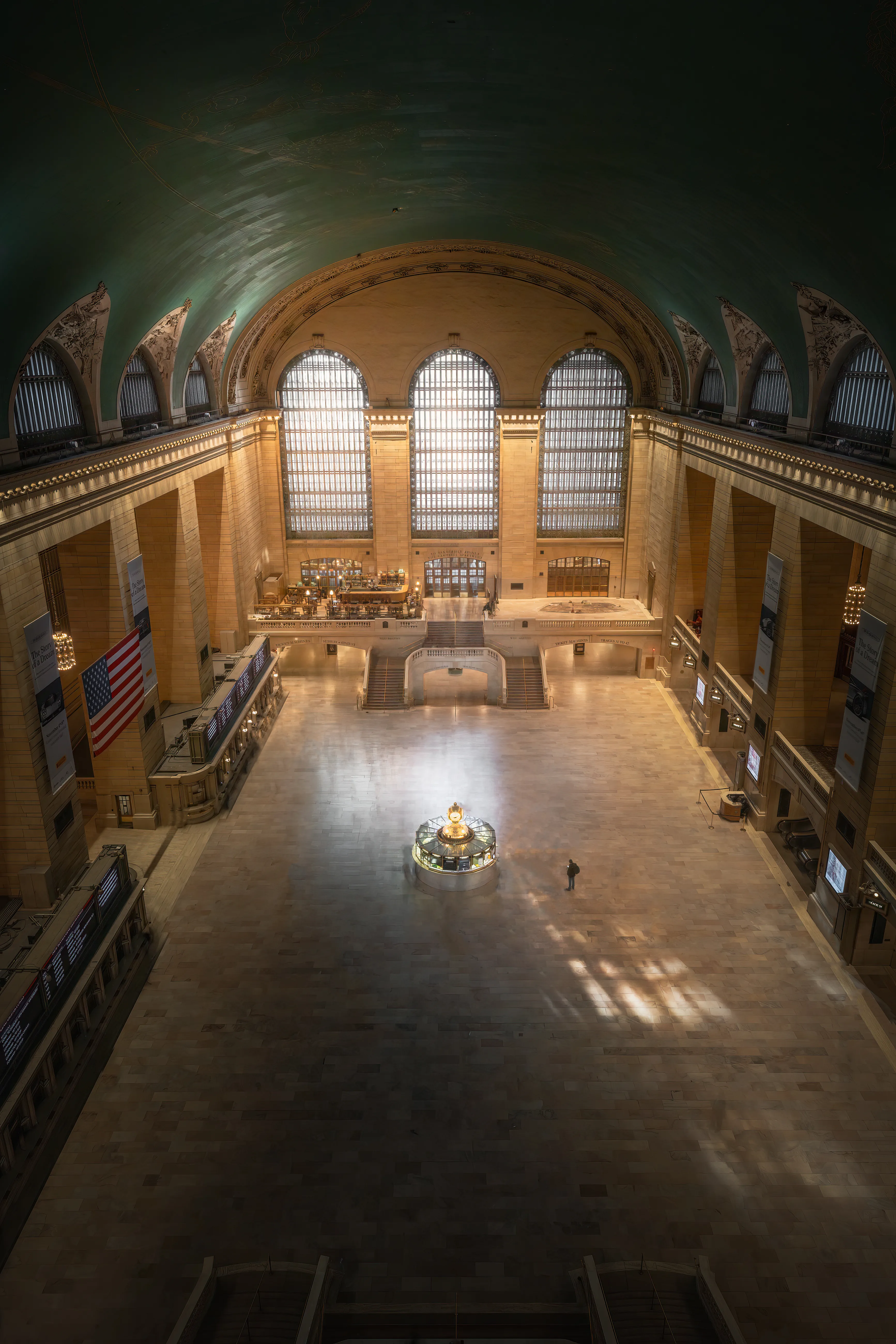 Time is a commodity in New York City, so people move with speed and intention.  There is no greater example of this than Grand Central Terminal during rush hour.  The Main Concourse is filled with thousands of people moving swiftly through the great hall as they make their way to their final destinations.  This image is a 2 minute exposure of the concourse during the morning rush hour.  The nature of long exposure photography, is that only stationary objects remain, while anything that is in constant movement is erased ny the exposure time.  You can imagine my surprise when I came across this file with only one person remaining still for the entire 2 minutes, giving the illusion of one solitary person in an extremely crowded room.