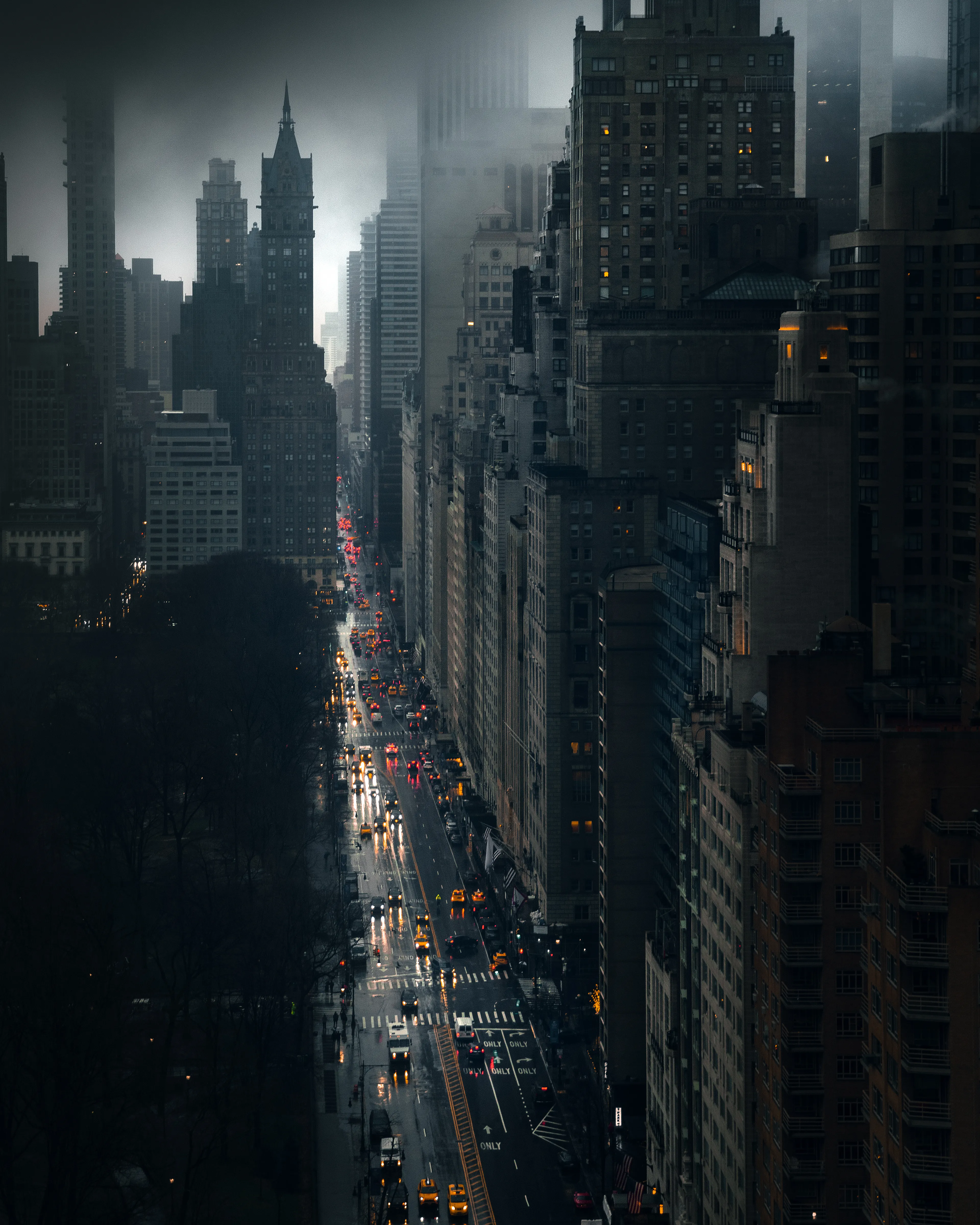 As the storm rolled in, I peered down from one of the many monoliths in the big city. What started out as a bright and sunny day quickly turned into a dark and gloomy setting. Down below, its citizens were undaunted. With umbrellas clutched over them, I could almost hear the pitter-patter of their footsteps as they hopped over puddles and went about their business amongst the sounds of honking cabs splashing in the streets.  I couldn’t help but marvel at how New York’s spirit can be inspiring, even in its darkest days.