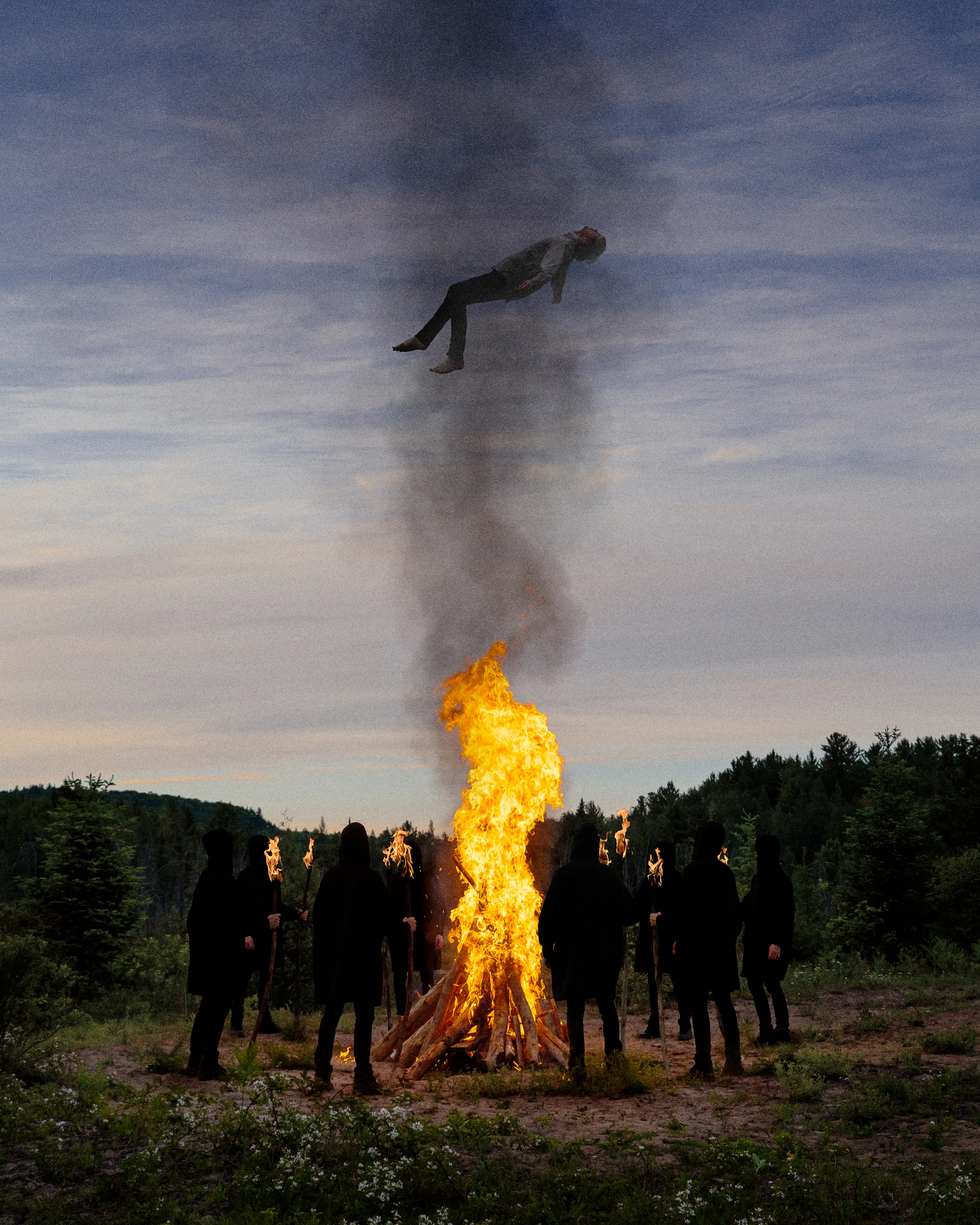 "Cleansing” depicts a figure being purified by the smoke of blazing flames burning below them. Surrounding the fire, several cloaked figures holding staffs with burning heads
stare up at the participant of the ritual, holding them still amidst the smoke as it billows over and through them.

Created for “Solstice”, the first virtual exhibition from 0xSociety, this image is a combination of self-portrait digital photography and digital manipulation created in Lanaudieres, Québec, Canada.