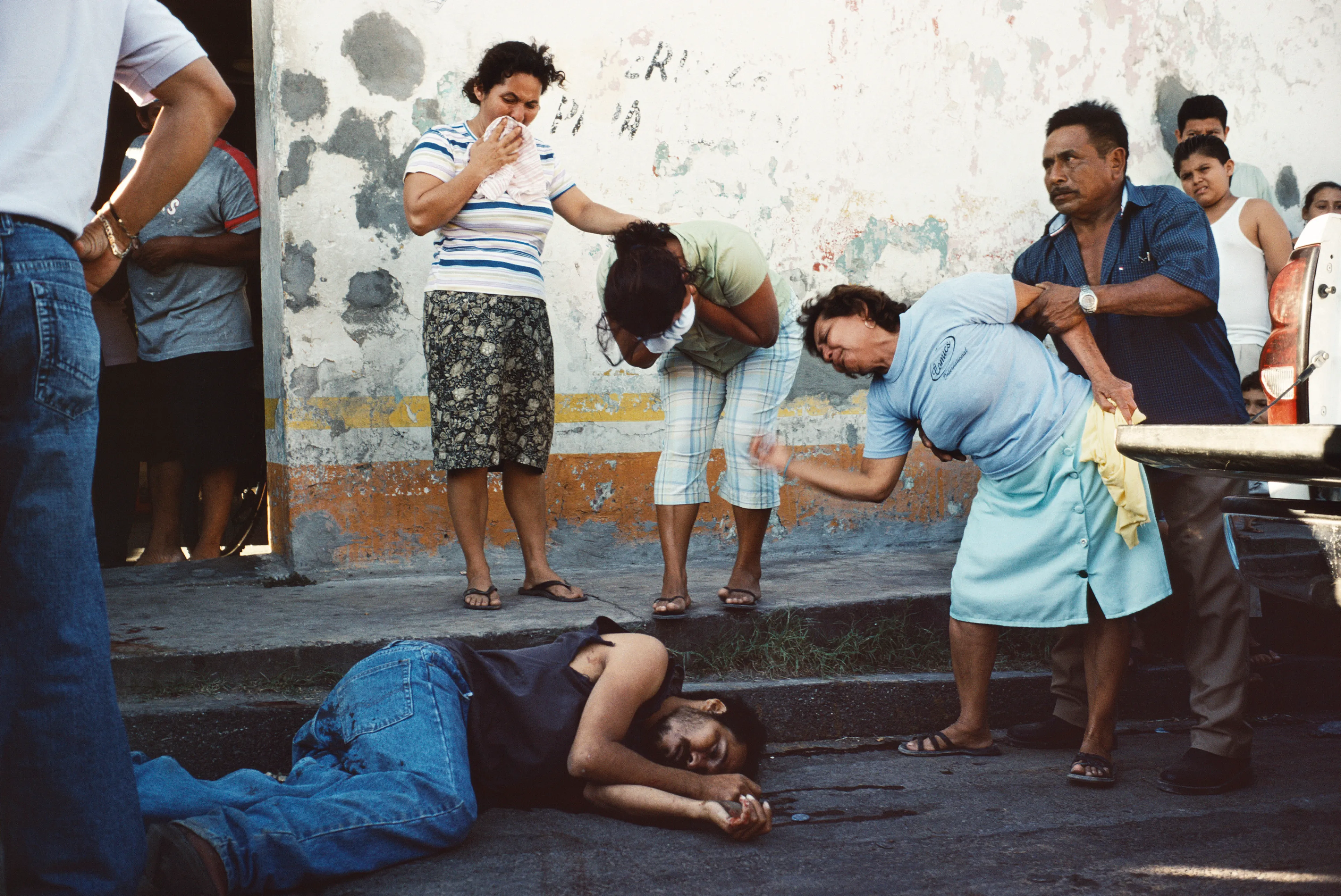 From his first visit in 1975, he was immediately captivated by the vibrant life in the streets of Mexico. While his early black and white photos often feature stark, striking graphics, his foray into color photography starting in 1978—inspired by the light and color of the Mexican streets—marks a turning point in his work.

Throughout his work from Mexico, his rich compositions create compelling visual complexity—‘La Calle’ features strong, saturated colors, which evoke haunting, enigmatic scenes of the everyday. “I work extremely intuitively. I wander, I respond,” he says. “Am I aware of certain elements rationally at times? Sure. But I think that often when I am more aware of them, it usually means that the picture falls flat.”

Webb somehow manages to capture these surprising scenes, which add an otherworldly poetry to the genre of street photography.
