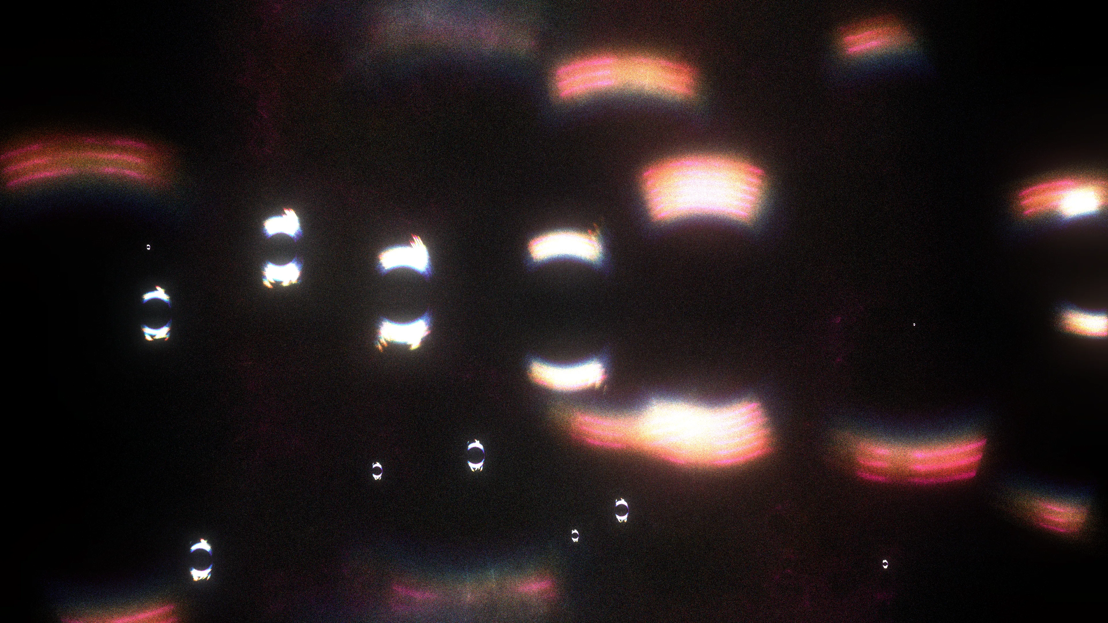 <p>At the moment of the primordial event (scientists call it the “Big Bang”), the universe had a high degree of symmetry, meaning its properties were consistent in all directions. As the universe evolved, some of those symmetries broke down, leading to the formation of matter and the diversity we observe today. Recent studies of this symmetry, and ways of breaking it, have helped modern physics uncover the origins of mass, the behavior of particles, and the structure of the universe itself, providing profound insights into the fundamental nature of reality.</p>
<p>In “A broken symmetry — the cat’s parabola,” HAL09999 experiments with slight variations on the initial conditions of a system made from millions of particles. By using simple physics in what the artist calls a “quasi-simulation,” these pixels are scattered through the space of the screen without any intention of a specific outcome. Any shapes observed in the final images are the consequence of the primordial asymmetry applied to the original system.</p>
<p>Without reference to scale, these works can represent the fundamental forms of phenomena that are typically invisible to the eye. Whether they are the shapes of cosmic birth and its expansion, splattered particles that make up the material world, or even intangible memories, these works share the harmony within the asymmetrical nature of our existence.</p>
