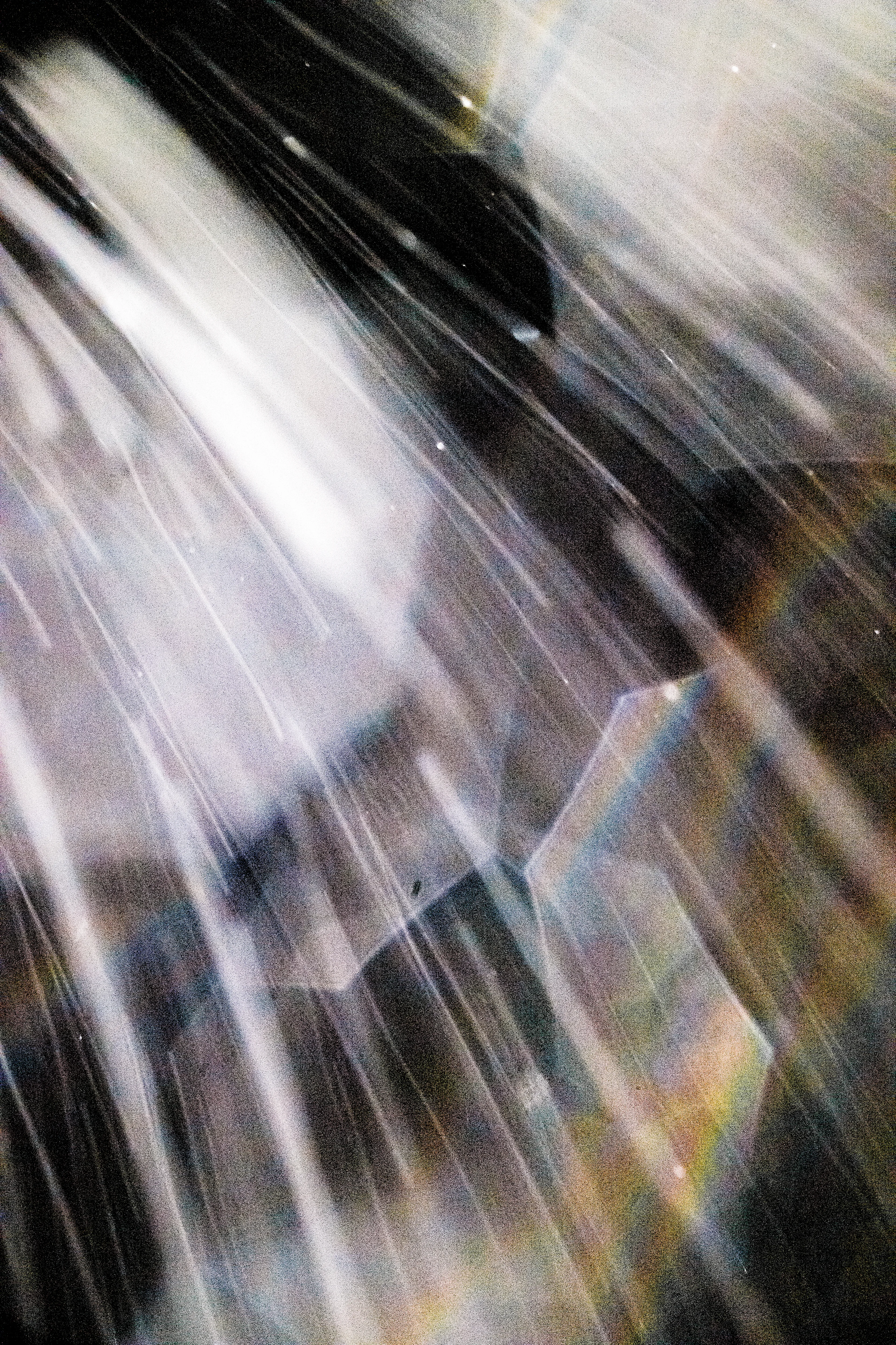 Peer into the looking glass of the SLURRIEST OF SEASONS. Photographic capture as physically generative action focuses into the light at the center of the storm. 