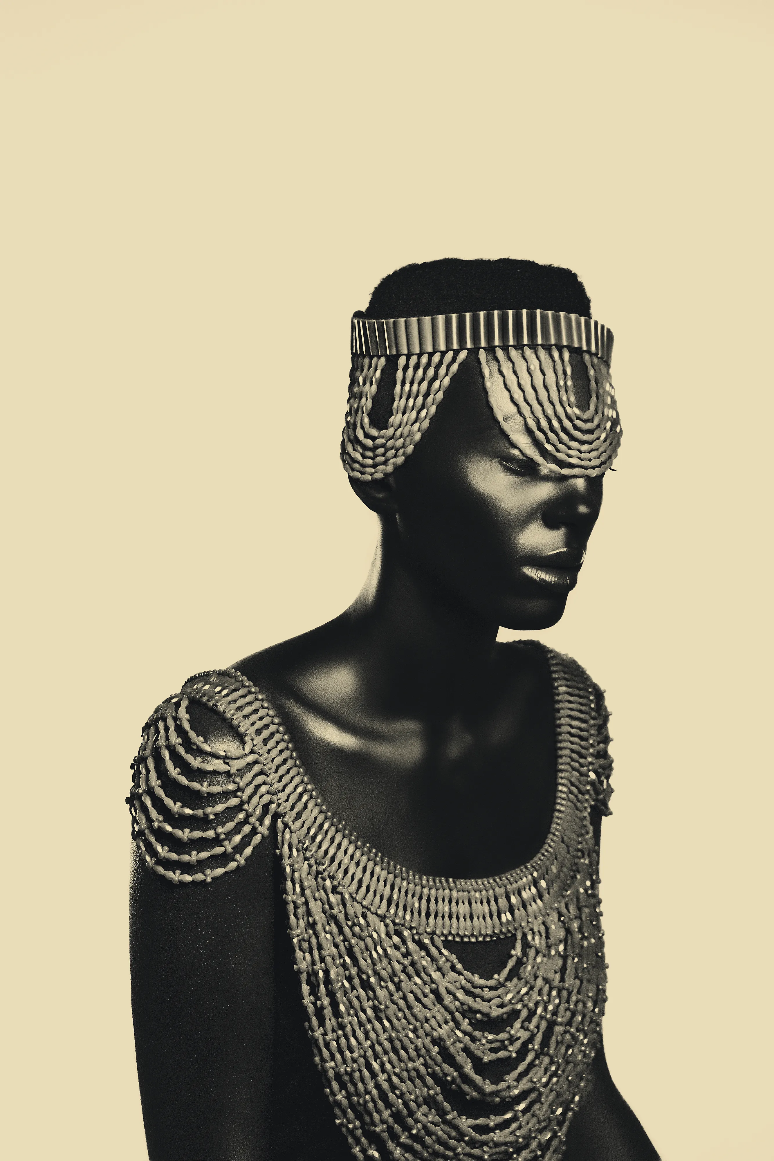 Edo by Asiko

The Adorned Series by Asiko is a collection of 15 portraits exploring the mystical intersection of the artist’s Yoruba culture and the beauty of black womanhood. In this collection, Asiko uses a golden monochrome background to put the spotlight on the female model, adorned with traditional Yoruba attributes.  

Edition: 1/1 

Dimensions: 2667x4000