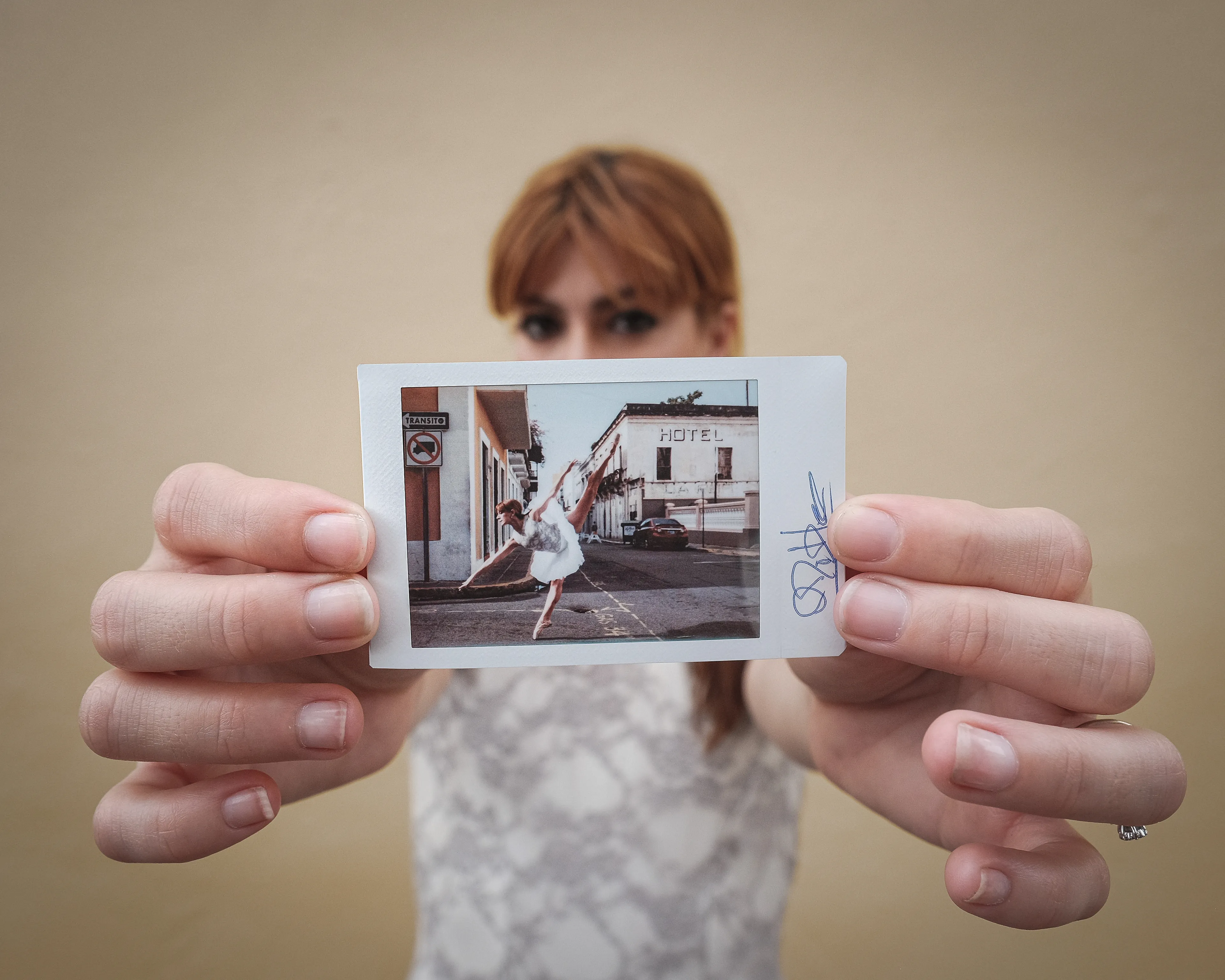 In 2013, I started a photography series that sought to inspire viewers to look at their urban surroundings in a new light. By featuring dancers in these settings, I aimed to challenge the way we perceive the spaces we encounter every day. Over the past nine years, this project has grown into a significant body of work that has shaped my career and opened up new opportunities for me. As a special gesture, I would often present the dancers with an instant photograph of our session together. Seeing their joy and pride in these mementos inspired me to start photographing them holding their instant prints. 'Dance Mementos' is a tribute to this ongoing series, showcasing a selection of my favorite images portraying the dancers with their photographs.