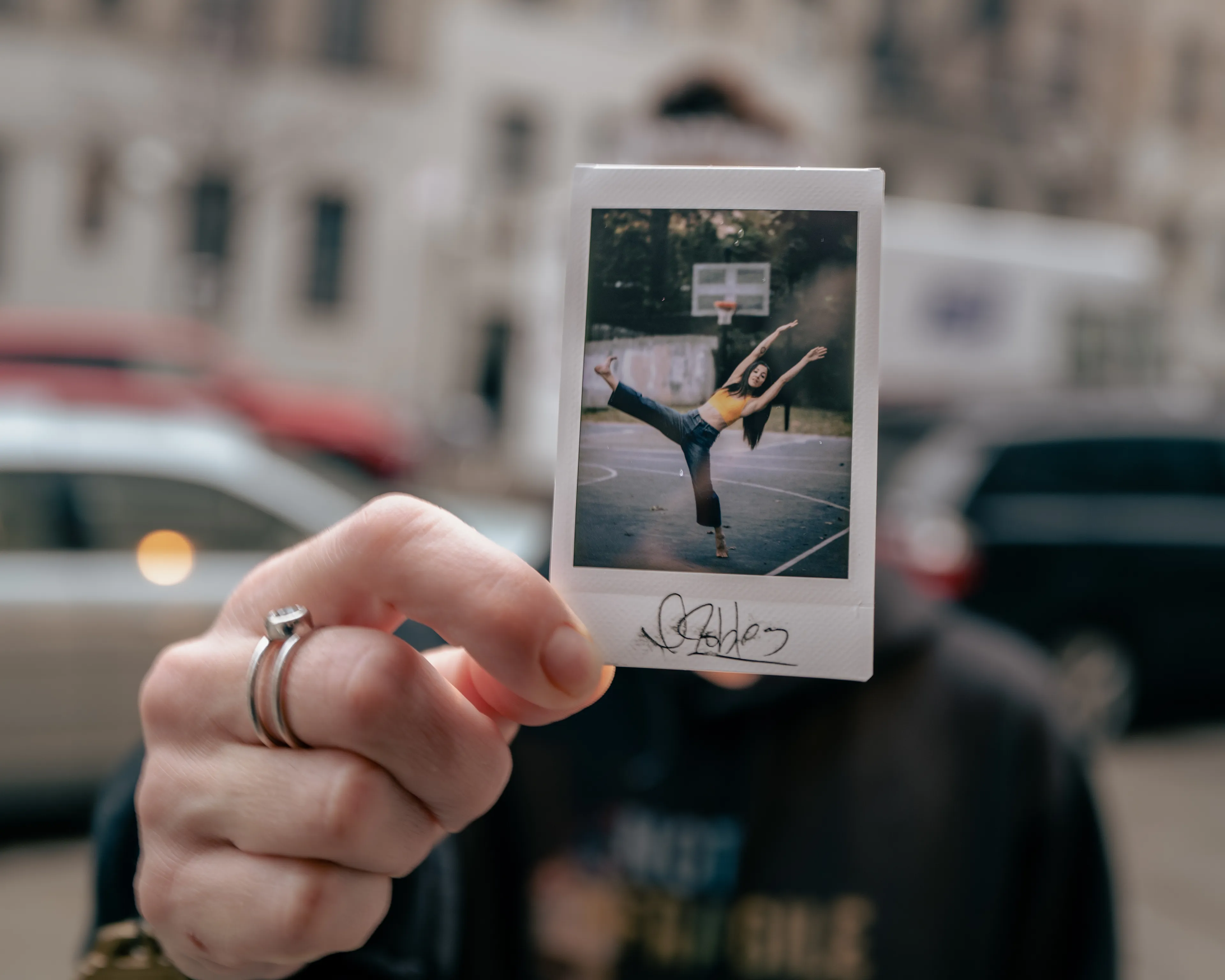 In 2013, I started a photography series that sought to inspire viewers to look at their urban surroundings in a new light. By featuring dancers in these settings, I aimed to challenge the way we perceive the spaces we encounter every day. Over the past nine years, this project has grown into a significant body of work that has shaped my career and opened up new opportunities for me. As a special gesture, I would often present the dancers with an instant photograph of our session together. Seeing their joy and pride in these mementos inspired me to start photographing them holding their instant prints. 'Dance Mementos' is a tribute to this ongoing series, showcasing a selection of my favorite images portraying the dancers with their photographs.