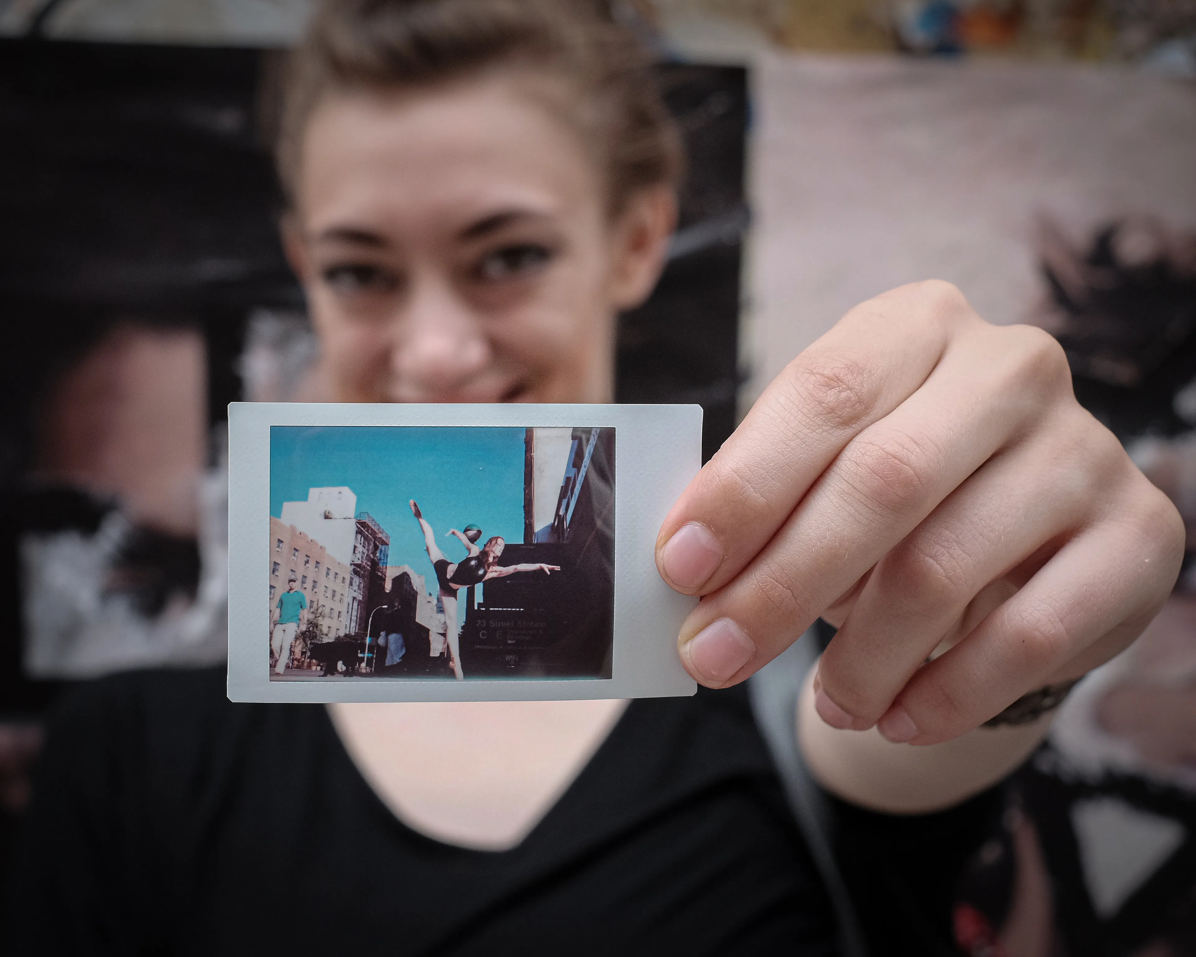 In 2013, I started a photography series that sought to inspire viewers to look at their urban surroundings in a new light. By featuring dancers in these settings, I aimed to challenge the way we perceive the spaces we encounter every day. Over the past nine years, this project has grown into a significant body of work that has shaped my career and opened up new opportunities for me. As a special gesture, I would often present the dancers with an instant photograph of our session together. Seeing their joy and pride in these mementos inspired me to start photographing them holding their instant prints. 'Dance Mementos' is a tribute to this ongoing series, showcasing a selection of my favorite images portraying the dancers with their photographs.