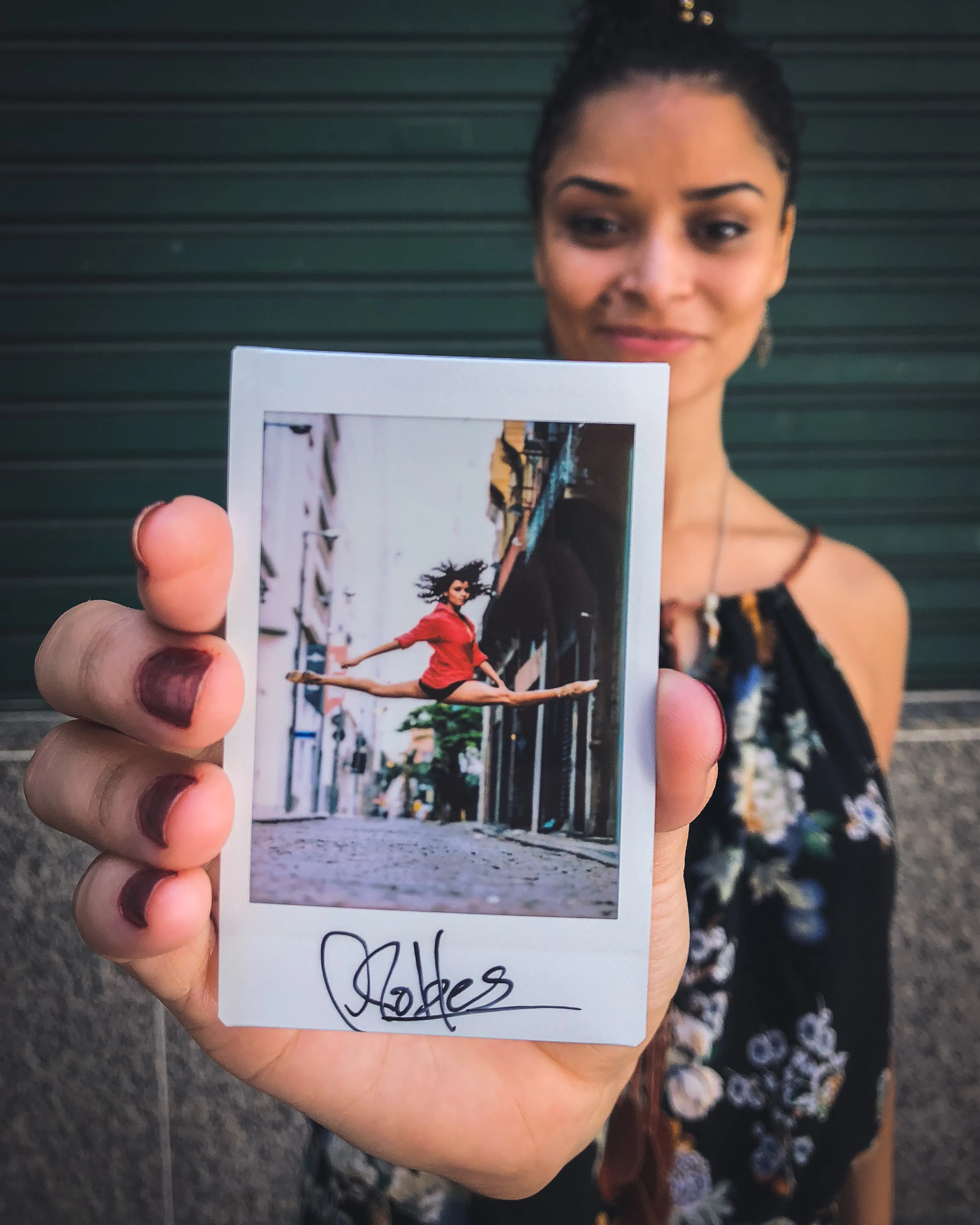 In 2013, I started a photography series that sought to inspire viewers to look at their urban surroundings in a new light. By featuring dancers in these settings, I aimed to challenge the way we perceive the spaces we encounter every day. Over the past nine years, this project has grown into a significant body of work that has shaped my career and opened up new opportunities for me. As a special gesture, I would often present the dancers with an instant photograph of our session together. Seeing their joy and pride in these mementos inspired me to start photographing them holding their instant prints. 'Dance Mementos' is a tribute to this ongoing series, showcasing a selection of my favorite images portraying the dancers with their photographs.