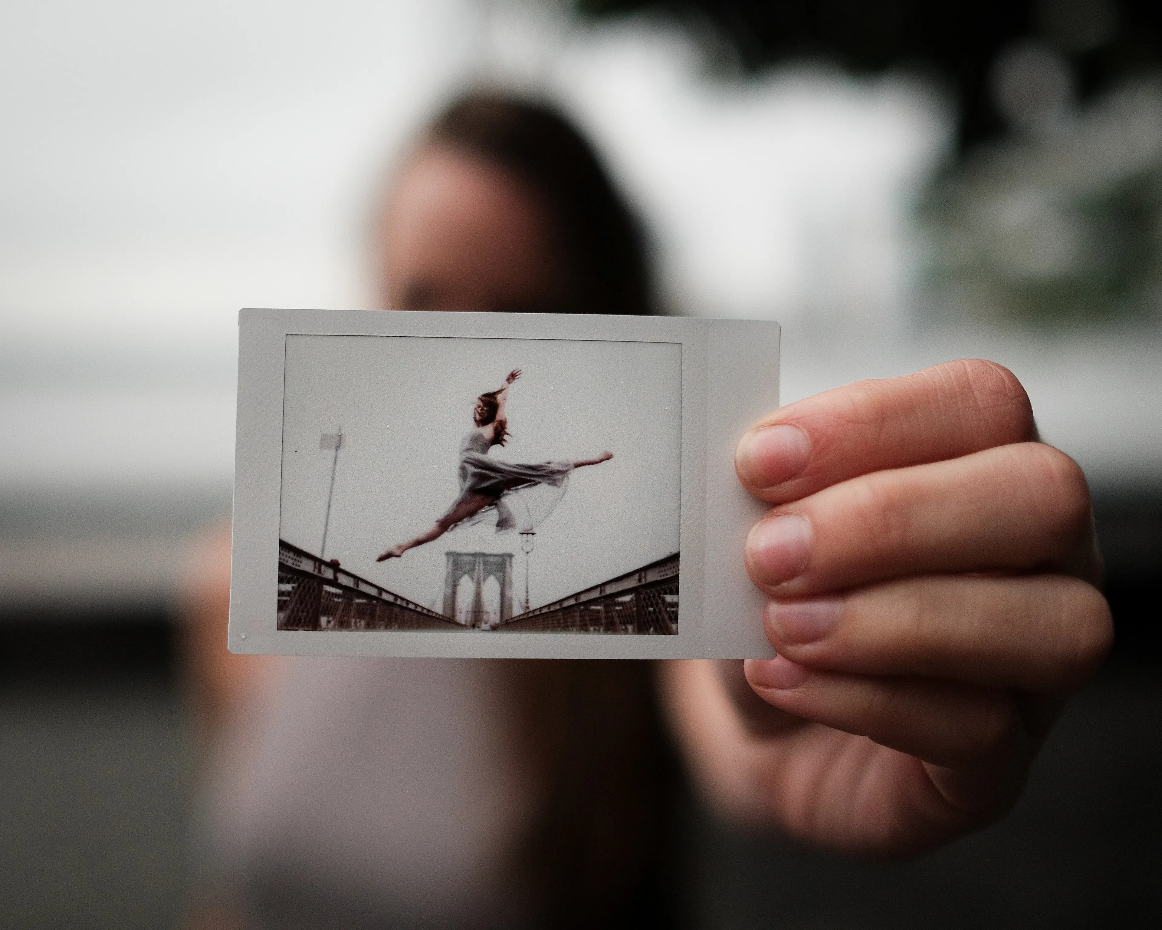 In 2013, I started a photography series that sought to inspire viewers to look at their urban surroundings in a new light. By featuring dancers in these settings, I aimed to challenge the way we perceive the spaces we encounter every day. Over the past nine years, this project has grown into a significant body of work that has shaped my career and opened up new opportunities for me. As a special gesture, I would often present the dancers with an instant photograph of our session together. Seeing their joy and pride in these mementos inspired me to start photographing them holding their instant prints. 'Dance Mementos' is a tribute to this ongoing series, showcasing a selection of my favorite images portraying the dancers with their photographs.