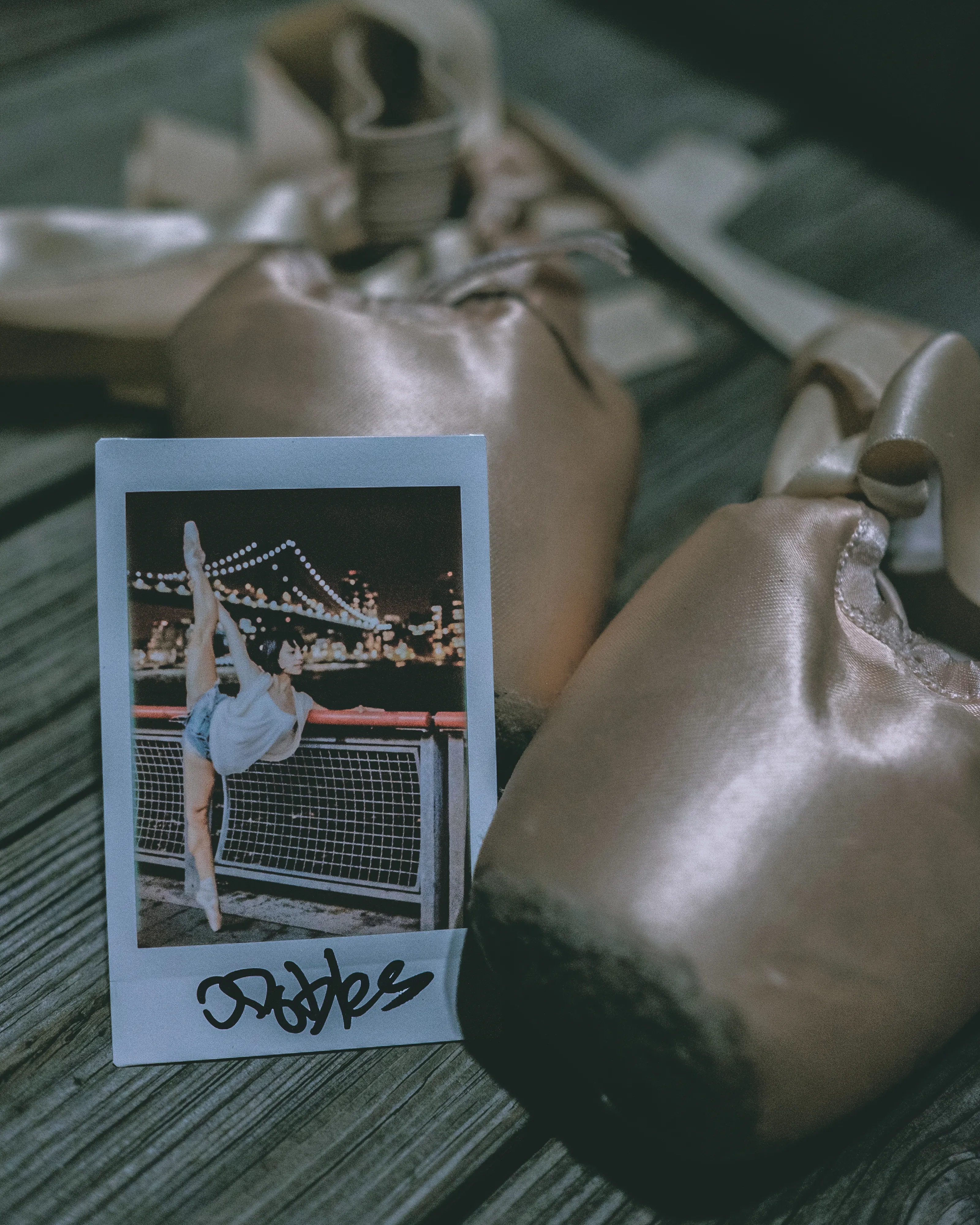 In 2013, I started a photography series that sought to inspire viewers to look at their urban surroundings in a new light. By featuring dancers in these settings, I aimed to challenge the way we perceive the spaces we encounter every day. Over the past nine years, this project has grown into a significant body of work that has shaped my career and opened up new opportunities for me. As a special gesture, I would often present the dancers with an instant photograph of our session together. Seeing their joy and pride in these mementos inspired me to start photographing them holding their instant prints. 'Dance Mementos' is a tribute to this ongoing series, showcasing a selection of my favorite images portraying the dancers with their photographs.