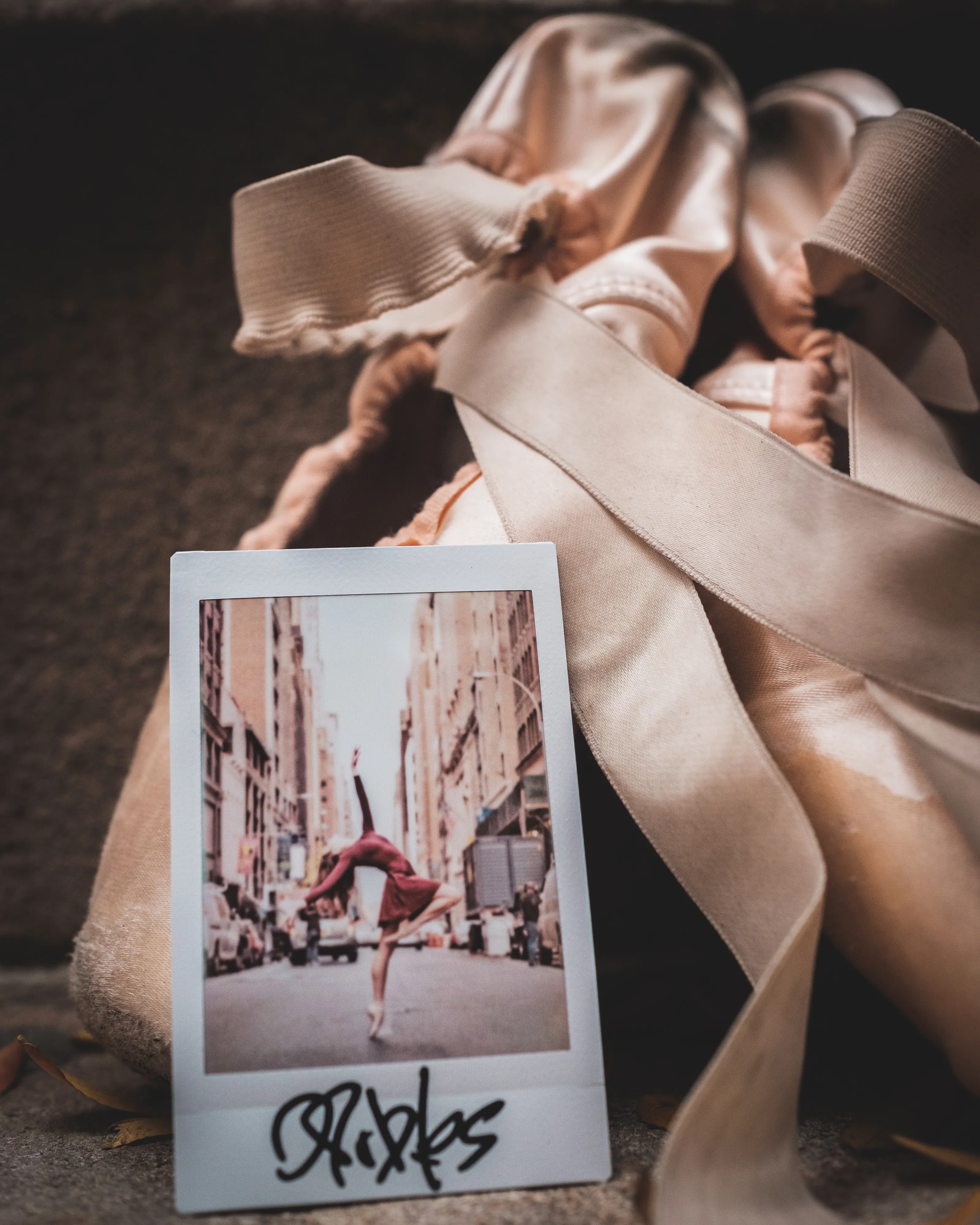 In 2013, I started a photography series that sought to inspire viewers to look at their urban surroundings in a new light. By featuring dancers in these settings, I aimed to challenge the way we perceive the spaces we encounter every day. Over the past nine years, this project has grown into a significant body of work that has shaped my career and opened up new opportunities for me. As a special gesture, I would often present the dancers with an instant photograph of our session together. Seeing their joy and pride in these mementos inspired me to start photographing them holding their instant prints. 'Dance Mementos' is a tribute to this ongoing series, showcasing a selection of my favorite images portraying the dancers with their photographs.