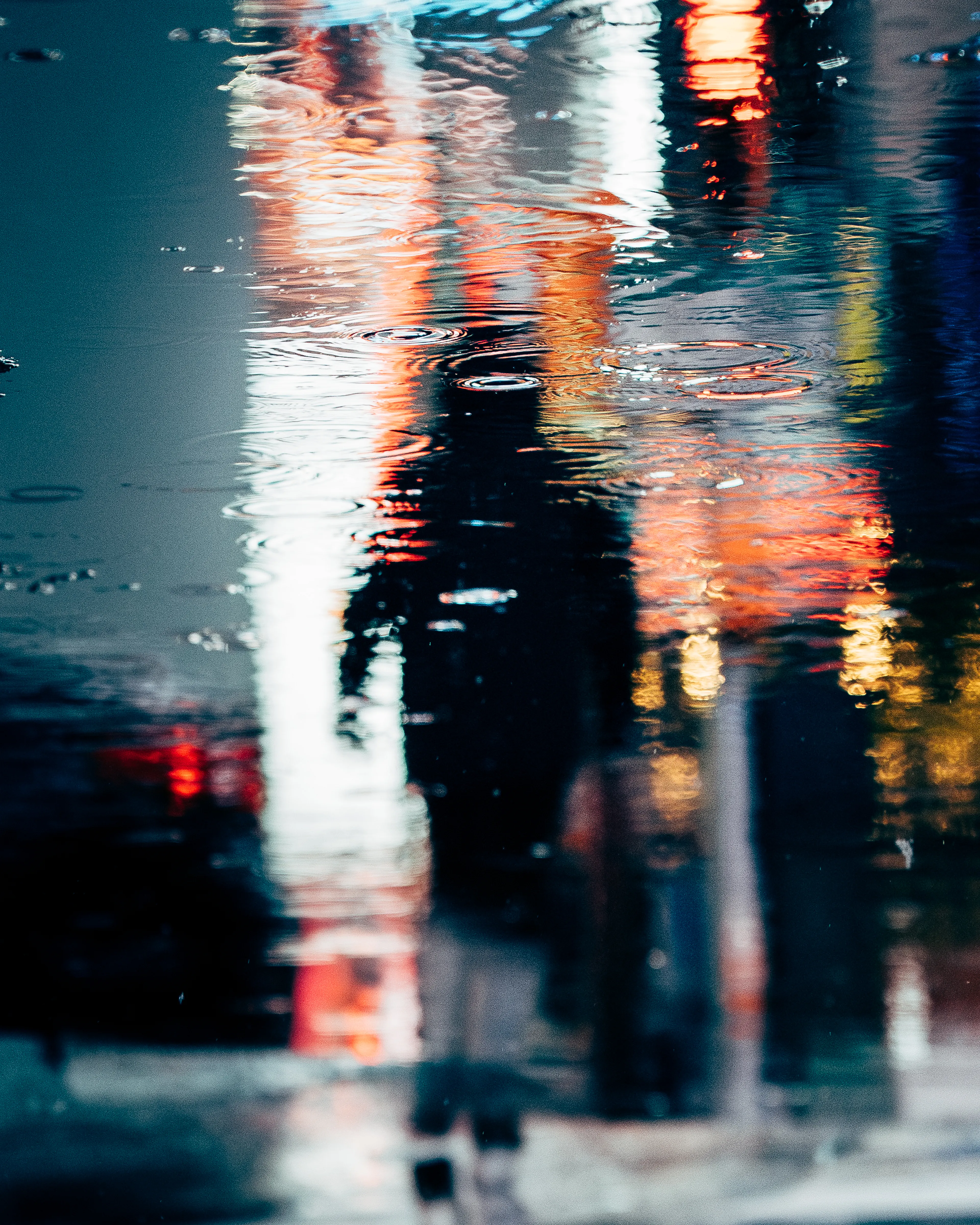 NIGHTMOVES is a 1/1/10, candid street photography collection from Dave Krugman that spans a decade of exploration of light in the neonoir setting of New York City by night. This collection is focused on the spectrum of artificial light against a natural dark, isolation in the density of the city, and the interplay of character and setting as found in these unstaged scenes. In these shadows, we can see ourselves, separated only by our luminous outlines. 

As soon as the sun sets in New York City, the world of night emerges. Darkness envelops the streets, and, one by one, the lights flicker on to push against the shadows. Shades move like ghosts through this continuum- shifting, blocking, bending light- like spirits projected from some distant realm who fade away as fast as you first saw them.  Every scene a stage for our shared story- motion at midnight, frozen in time, held still for just this instant- from dusk ‘til dawn is NIGHTMOVES