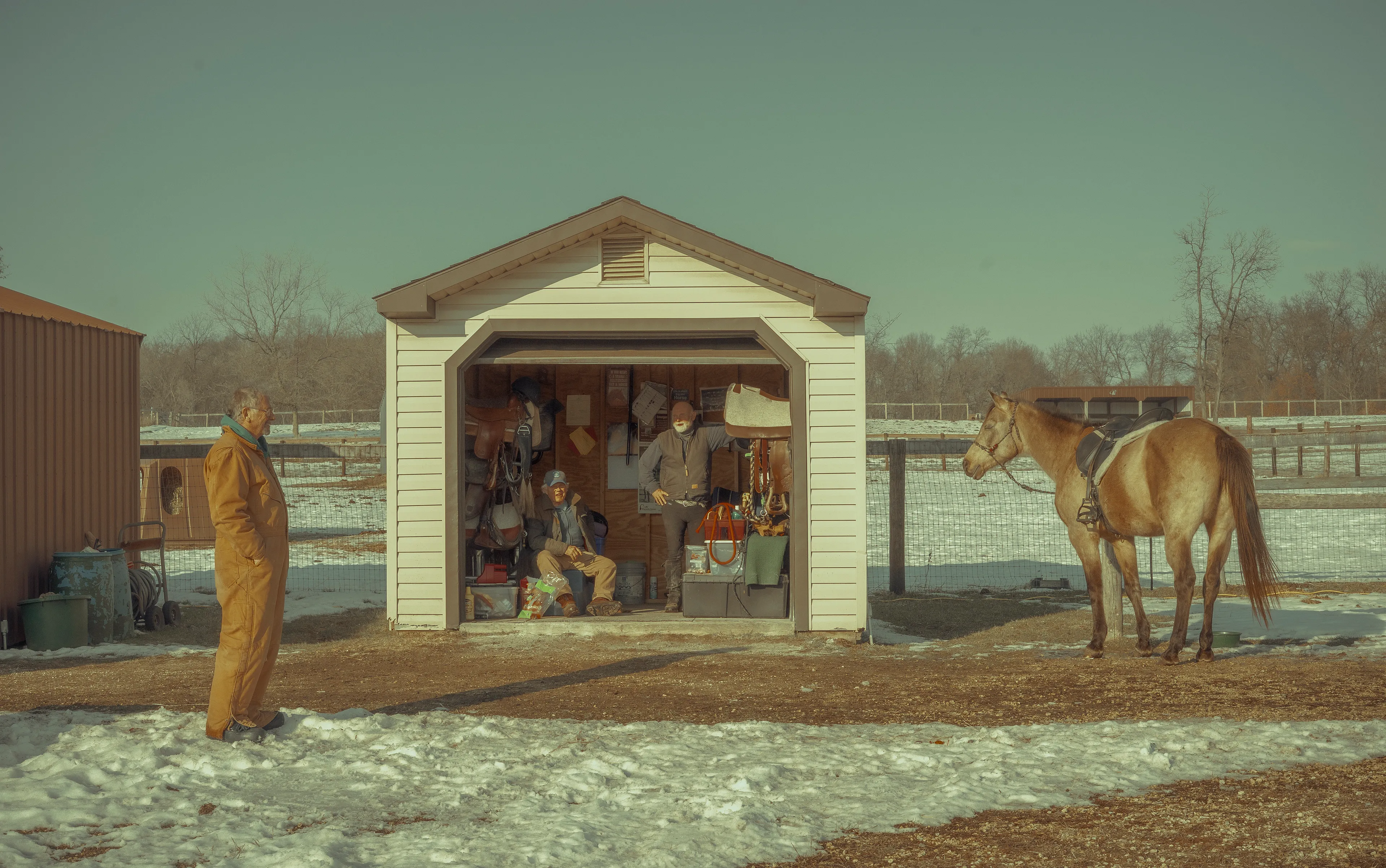 The Silent Hunt #4 Where We Go to Cope by Summer Wagner

"We wouldn't have survived without this place to go to." - Bill (Center) on escaping the pandemic at Lockwood Equestrian Centre. He visits his two horses daily. 

The Silent Hunt explores the quiet search for connection, intimacy, and ways to cope during the last two years of an international pandemic. Peering specifically into the lives of boys and men of at least three different generations, The Silent Hunt demonstrates an earnest search for belonging and duty in an increasingly atomized world. 

Edition: 1 of 1

Commissioned by Obscura