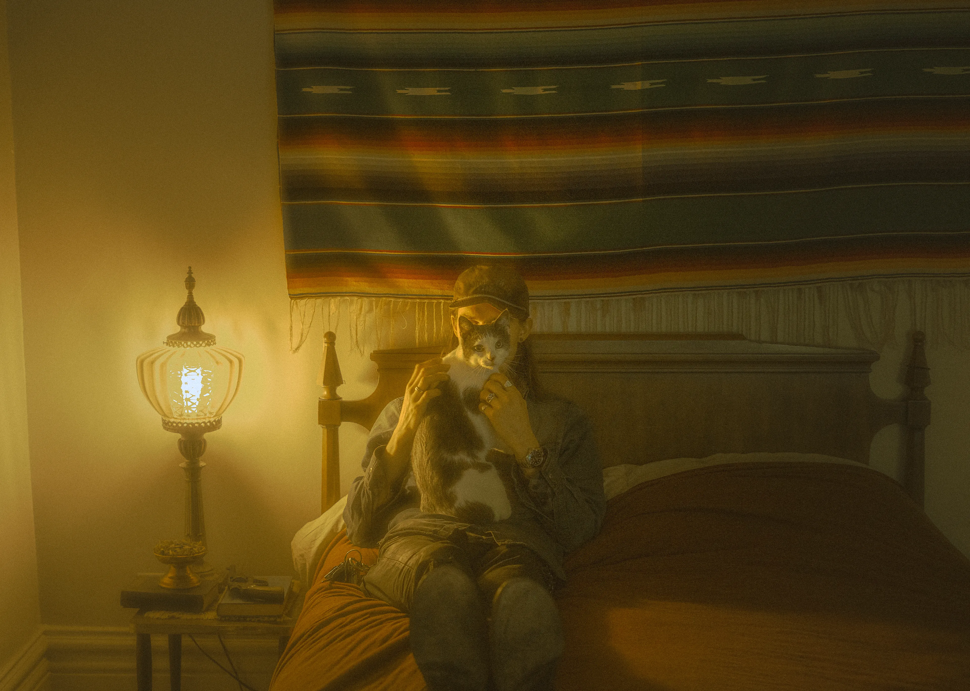 The Silent Hunt #8 The Cat who Saved His Life by Summer Wagner

Forest, a rescue cat from a local shelter, hunts my camera as I shoot in his father's room. 

The Silent Hunt explores the quiet search for connection, intimacy, and ways to cope during the last two years of an international pandemic. Peering specifically into the lives of boys and men of at least three different generations, The Silent Hunt demonstrates an earnest search for belonging and duty in an increasingly atomized world. 

Edition: 1 of 1

Commissioned by Obscura