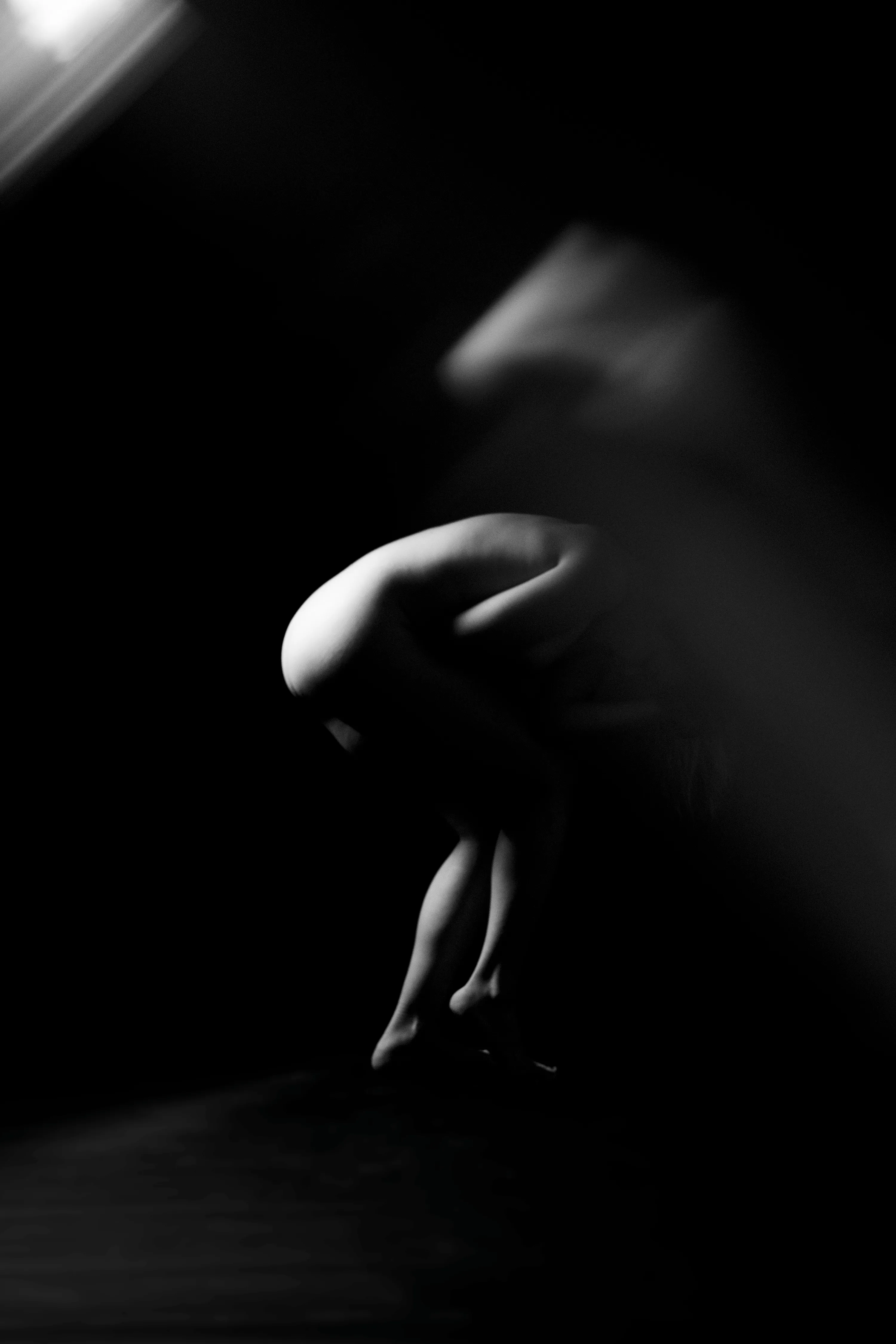 Figure Studies is a series of nude portraits that subverts the viewer’s expectations of the female form. Shot through glass, the images are distorted, even ghost-like. Though strange and unsettling, the forms remain familiar and beautiful. Light finds the bodies in the dark while holding the viewer at arm’s length, as if seen through a veil. 

Part of Caitlin Cronenberg’s Figure Studies collection. 
