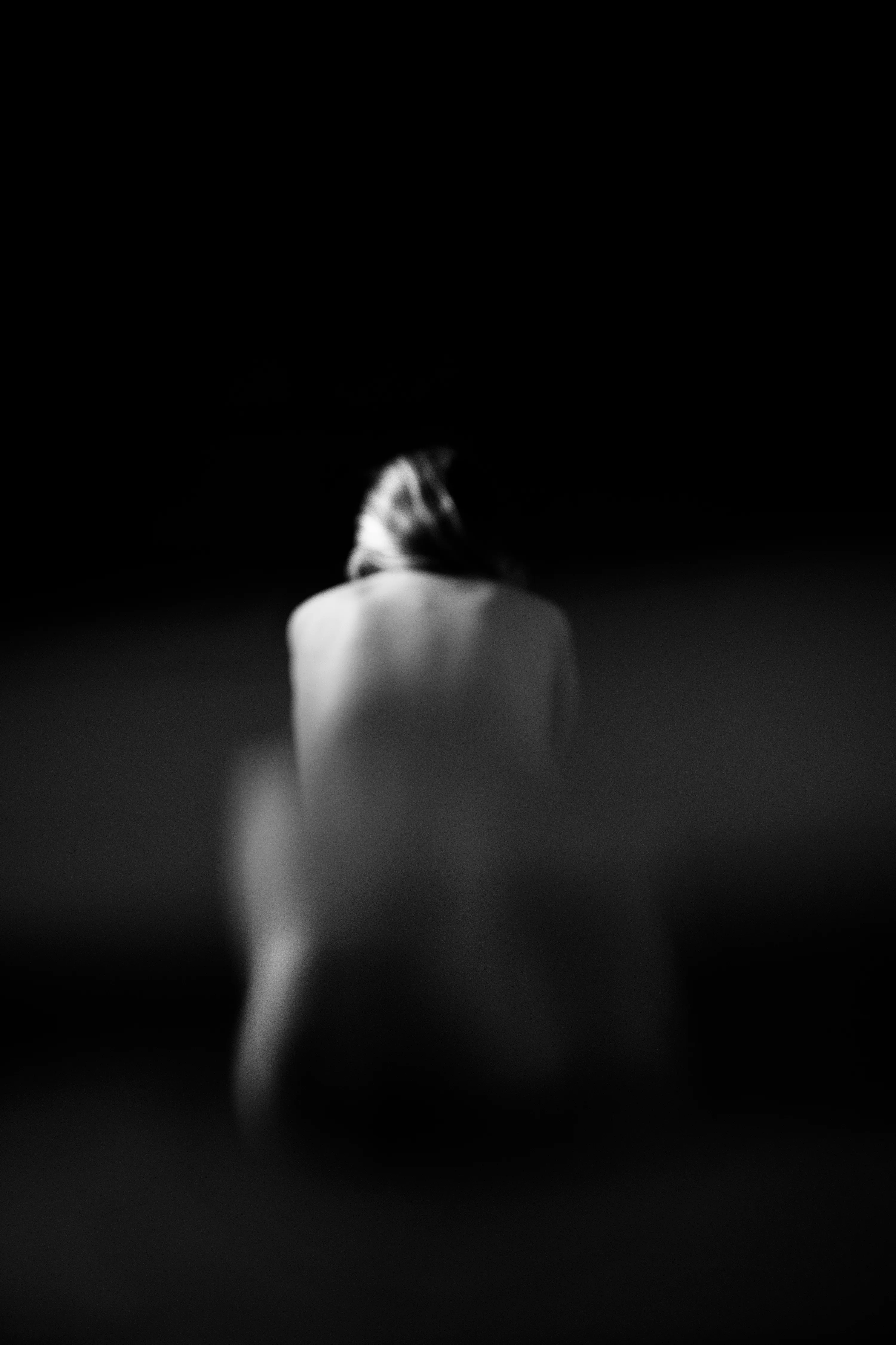 Figure Studies is a series of nude portraits that subverts the viewer’s expectations of the female form. Shot through glass, the images are distorted, even ghost-like. Though strange and unsettling, the forms remain familiar and beautiful. Light finds the bodies in the dark while holding the viewer at arm’s length, as if seen through a veil. 

Part of Caitlin Cronenberg’s Figure Studies collection. 
