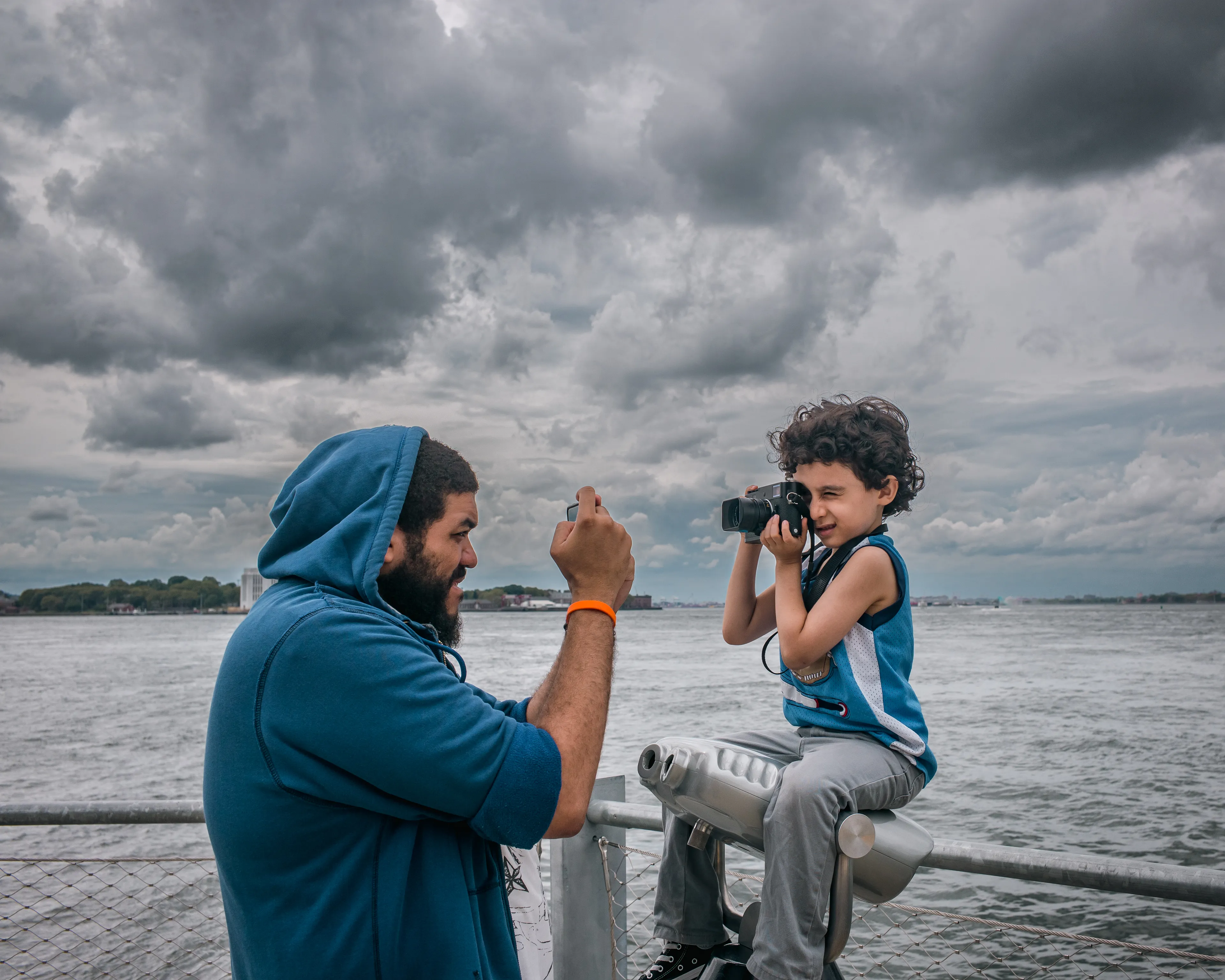 September 12, 2015

City-Dads:

As I roam the City streets, with my camera in hand, I find myself lost on this concrete playground. Everything is so big, larger than life. And in a snap, I am once again a child. Playful and unstoppable, just like when I played superheroes.

Yet, at the same time, I feel so vulnerable and scared inside. Afraid of stumbling upon a demon in some unforeseen corner of my mind. Then, I remember your figure, I can see you all around. Your melodic voice and gregarious smile. But it is just a mirage. You are back home, and I am a grown man, capable of facing the world on his own. Still, if you only knew how much I wish you were here, to play with me, to protect me, or just to be by my side right now…Dad.
