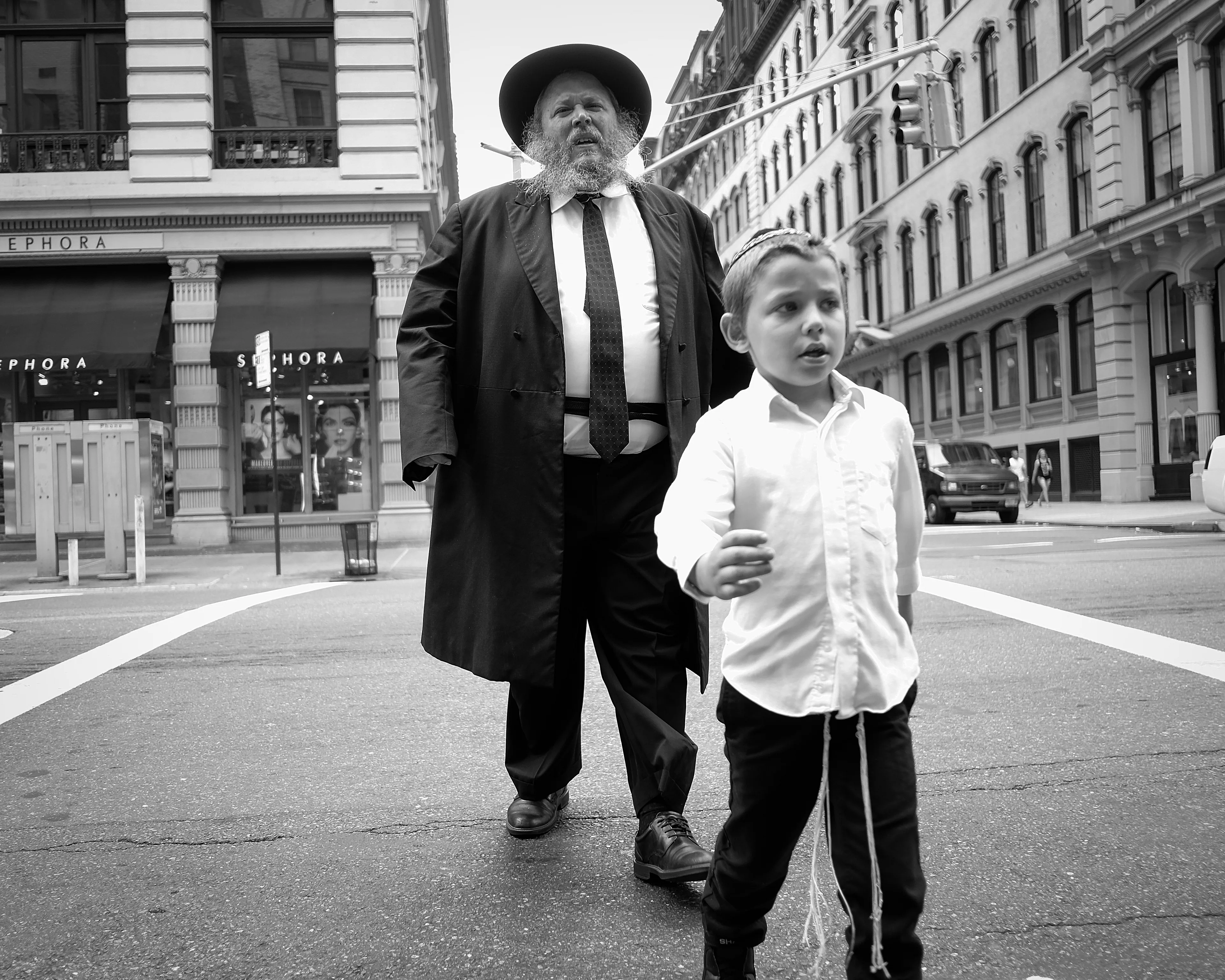 September 6, 2014

City-Dads:

As I roam the City streets, with my camera in hand, I find myself lost on this concrete playground. Everything is so big, larger than life. And in a snap, I am once again a child. Playful and unstoppable, just like when I played superheroes.

Yet, at the same time, I feel so vulnerable and scared inside. Afraid of stumbling upon a demon in some unforeseen corner of my mind. Then, I remember your figure, I can see you all around. Your melodic voice and gregarious smile. But it is just a mirage. You are back home, and I am a grown man, capable of facing the world on his own. Still, if you only knew how much I wish you were here, to play with me, to protect me, or just to be by my side right now…Dad.