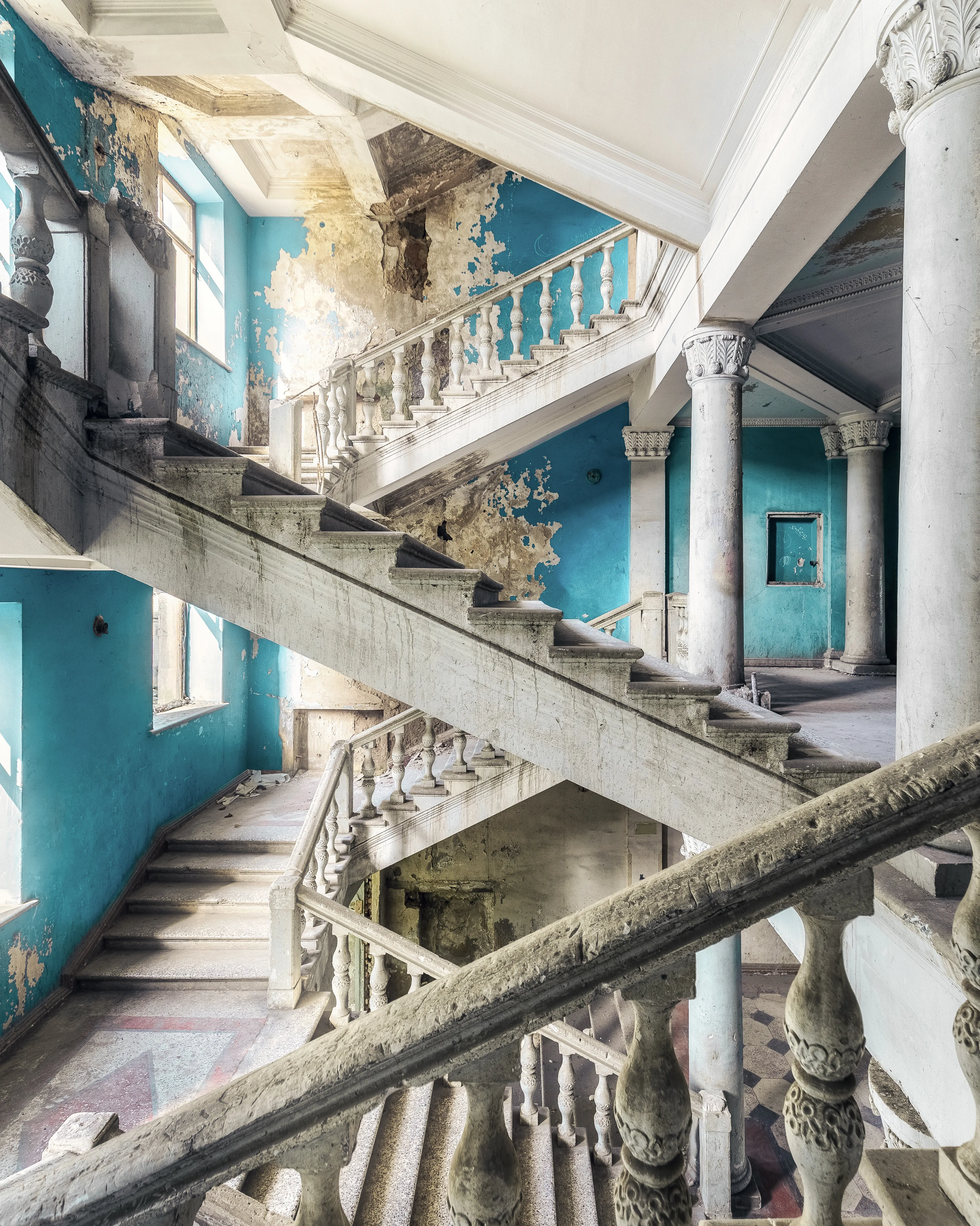 I took this picture 2019 in an old sanatorium in Georgia, where members of the communist party of the USSR once spent their holidays.

These relics still radiate the utopian ideas of the Soviet idea. Oversized pomp and splendour, but reserved only for the privileged party members, while the poor people were further deluded about equality and the national economy.

Nevertheless, one cannot deny the architectural beauty of these places. It is the only thing that will remain, while the utopian ideas broke down into their pieces.

  