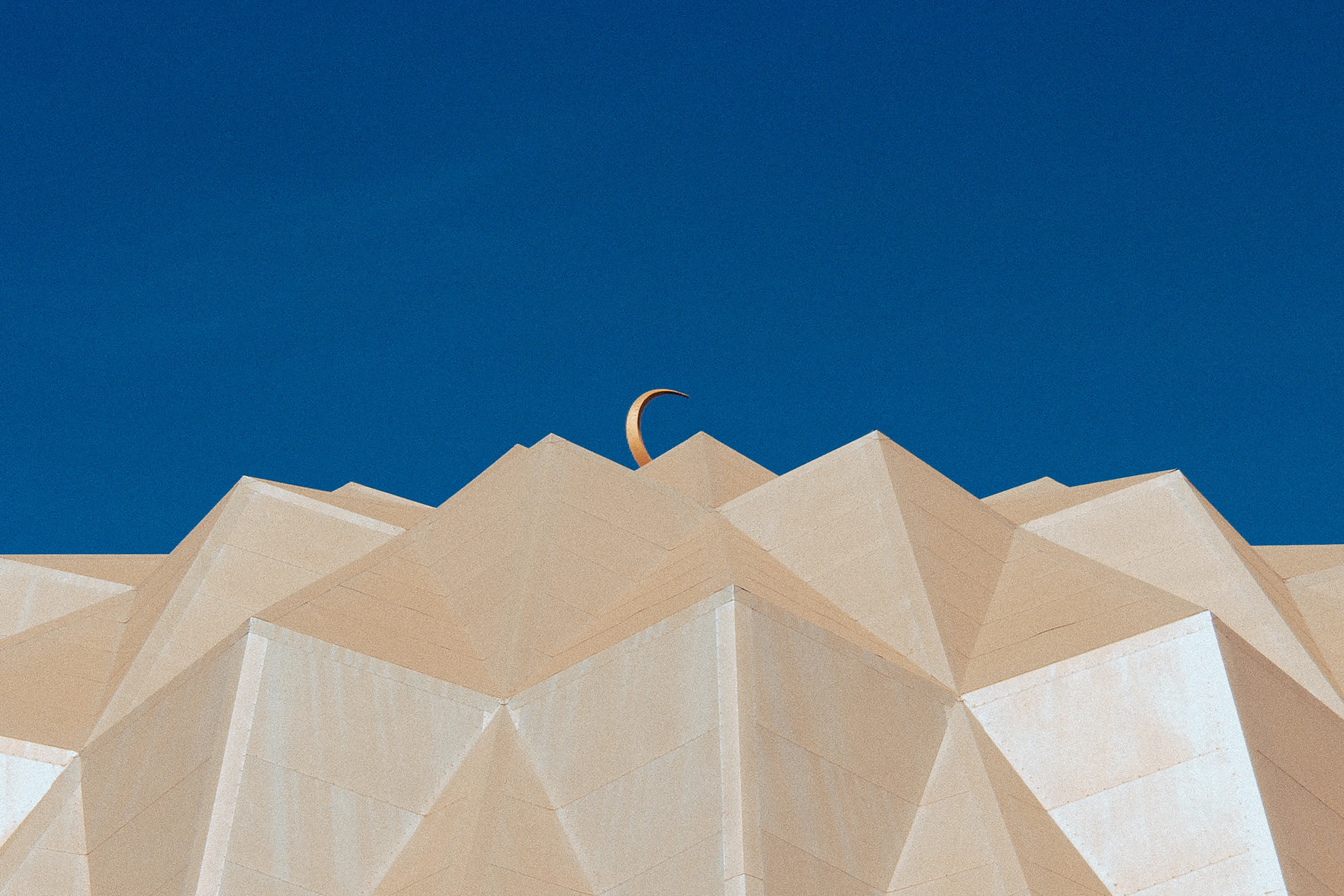 This photograph captures the beauty of the geometric dome to the 'Mosque of the Two Niles'. The mosque is situated by the confulence of the two niles in Omdurman. 

It is also one of Sudan's most popular architectural landmarks.

Photograph  taken  in  2022 (pre-war).  
Print  available  upon  request. 
All proceeds from the collection will go towards families who need to escape the brutality of the current war.