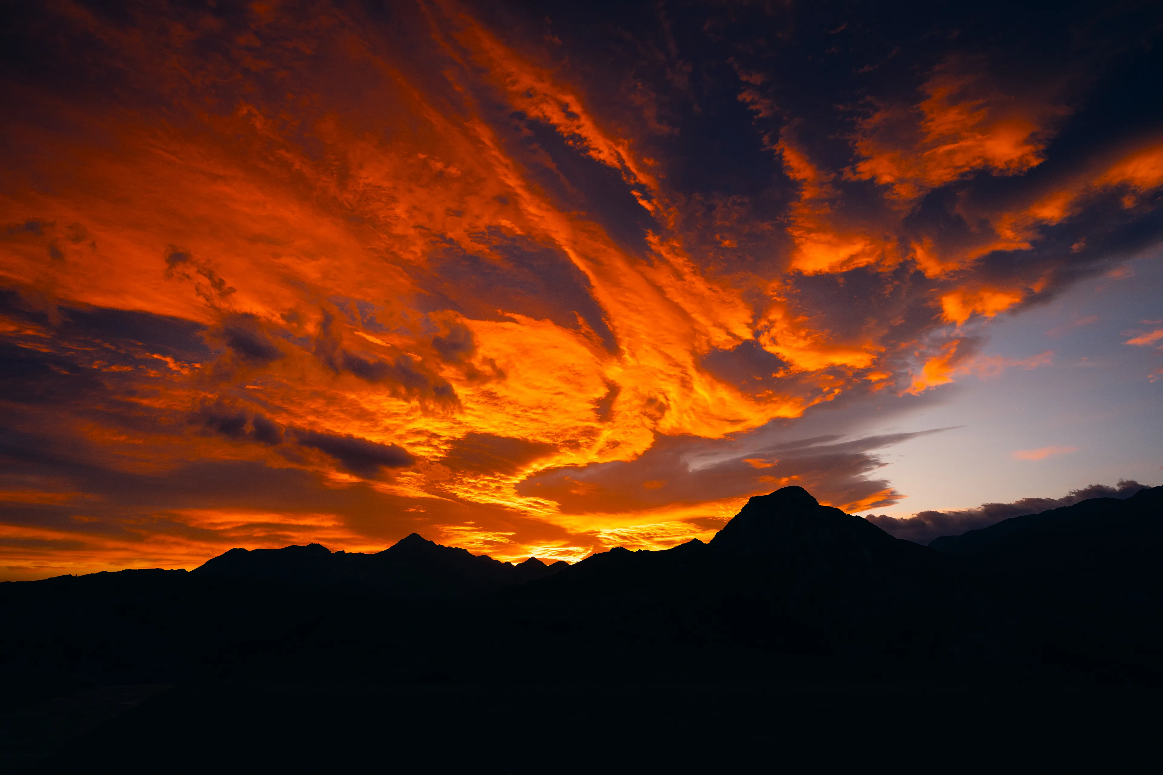 There’s something about the way the sky sets itself on fire before the world wakes up. Like it needs to break apart before it can start over. Like it has to burn through every shade of itself just to remember how to be whole again.

Maybe that’s what mornings are, proof that endings can look like beginnings. That sometimes, you have to fall apart before you find your way back.

Or maybe it’s just the sky, doing what it’s always done, without waiting for anyone to notice.

Photo taken at the Covandonga Lakes in the Picos de Europa National Park, Asturias (October 2022)