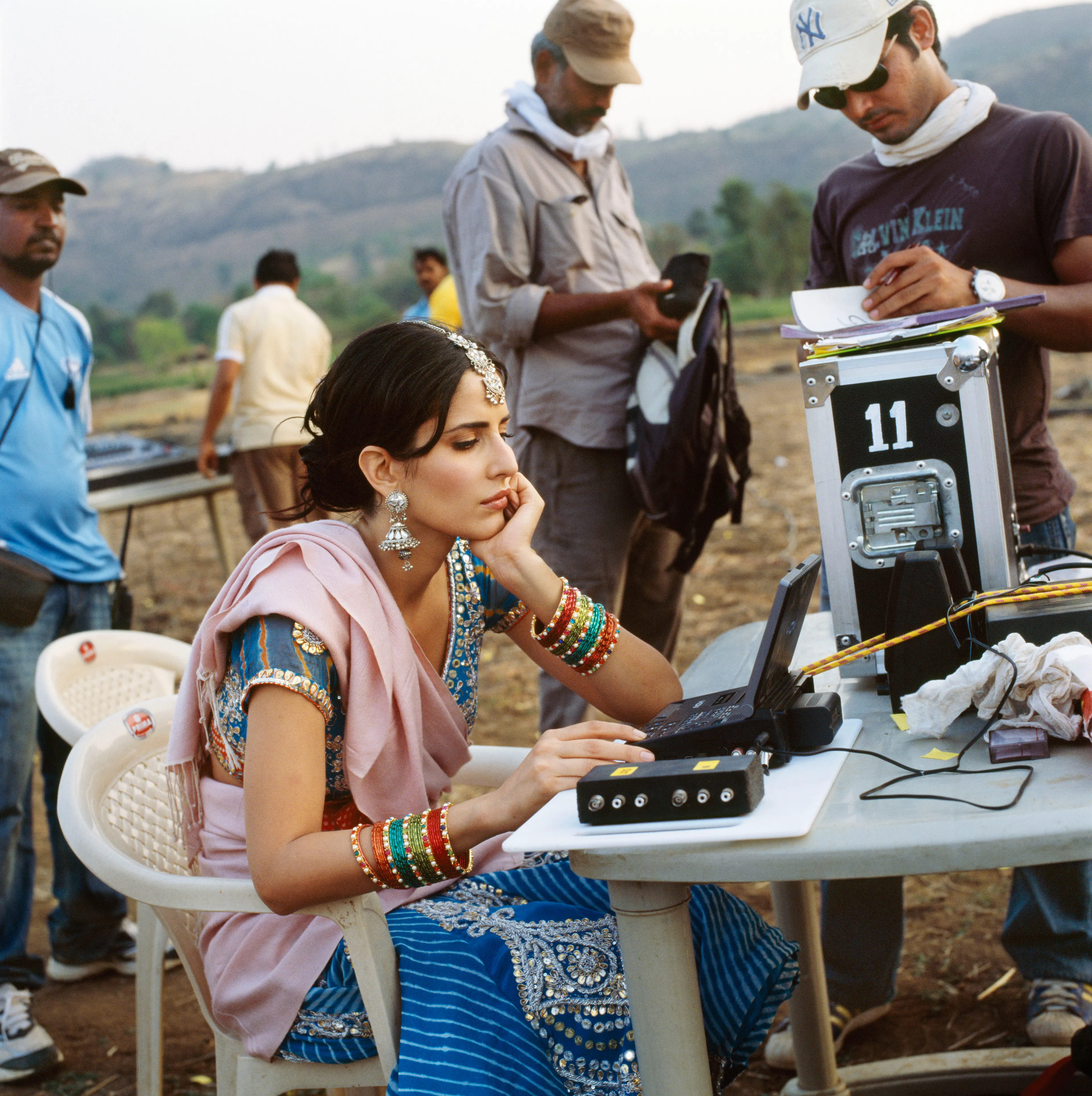 Magnum 75 #121 by Alessandra Sanguinetti. Maharashtra, India. 2010  
Actor Katrina Kaif on set in Malsej Ghat.

Magnum 75 is the inaugural NFT collection by Magnum Photos. Created in 2022 for the agency’s 75th anniversary year and released in three curations, the collection brings together 225 iconic images from Magnum photographers, taken across seven decades.

Each curation is composed in dialogue with a leading picture editor from across the globe and selected to embody the agency’s past, present, and future. This second curation was made in dialogue with Azu Nwagbogu, founder and director of African Artists’ Foundation and director of LagosPhoto Festival.

Nwagbogu says: “The vast Magnum archive reveals so much about the history of the modern world and its unresolved global issues with regard to ecology, humanity and technology. Rather than exploring Henri Cartier-Bresson’s ‘decisive moment,’ this collection studies the ‘indecisive moment’ — the interstitial spaces, the energized subjects floating in-between events, where little obvious action occurs but where the subject(s) seem to be caught in anticipation. Each image is charged with feeling, intent, foreboding, and meaning, composed with a sense of expectation that offers multiple scenarios and possibilities about past events. It is not revisionist history, but rather invites the collector and viewers to perhaps look at the image again, more closely.”

Edition: 1 of 1

© Alessandra Sanguinetti/Magnum Photos 2022 All Rights Reserved  
www.magnumphotos.com/terms-conditions/