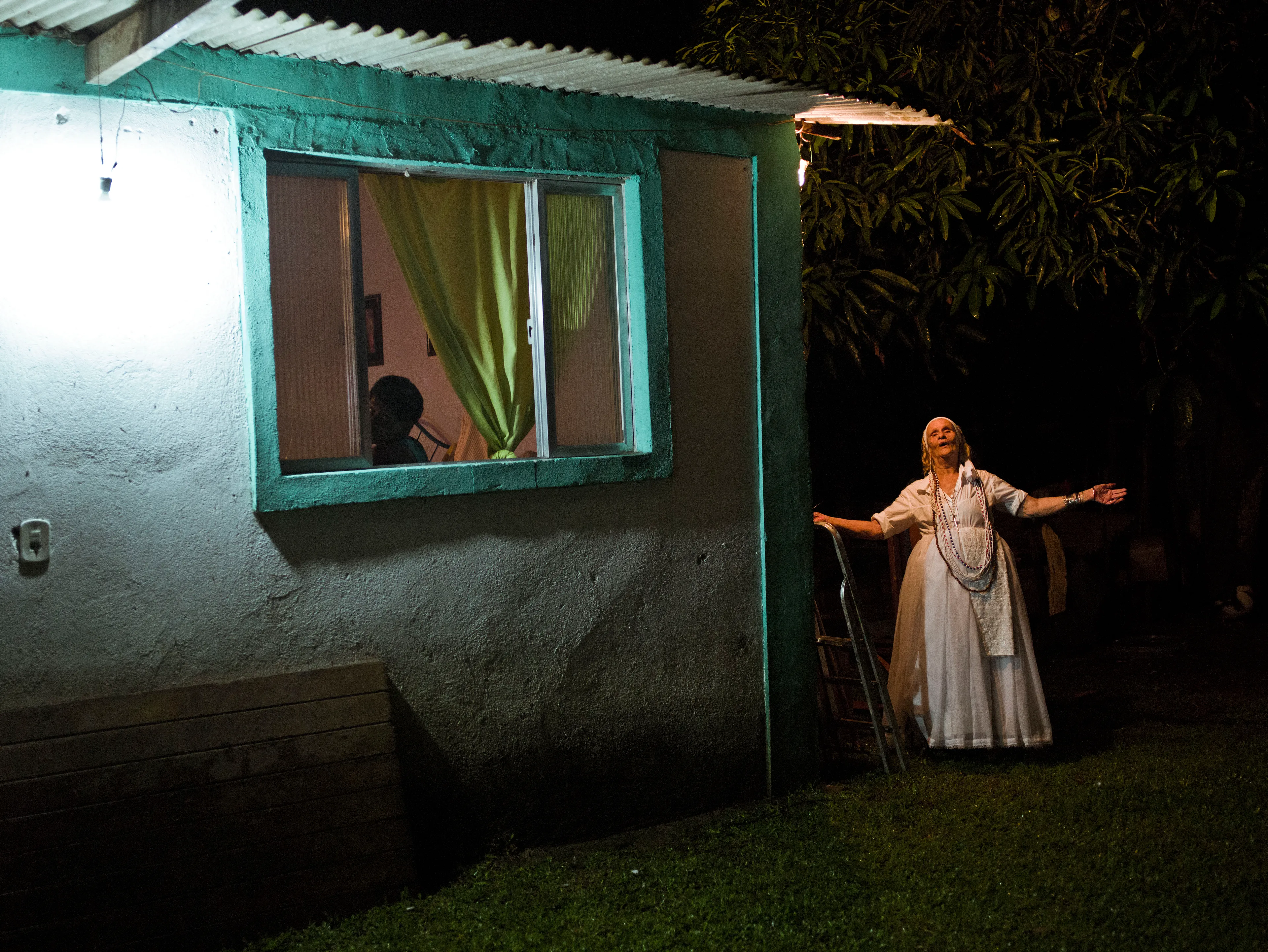 Magnum 75 #118 by Cristina de Middel. Rio de Janeiro, Brazil. 2016  
A ceremony for Exú at the temple ‘Tenda Espirita Caboclo Sete Flechas Pai Benedito Beira Mar’ in Piabetá. From the series ‘Midnight at the Crossroads,’ a collaboration between de Middel and Bruno Morais.

Magnum 75 is the inaugural NFT collection by Magnum Photos. Created in 2022 for the agency’s 75th anniversary year and released in three curations, the collection brings together 225 iconic images from Magnum photographers, taken across seven decades.

Each curation is composed in dialogue with a leading picture editor from across the globe and selected to embody the agency’s past, present, and future. This second curation was made in dialogue with Azu Nwagbogu, founder and director of African Artists’ Foundation and director of LagosPhoto Festival.

Nwagbogu says: “The vast Magnum archive reveals so much about the history of the modern world and its unresolved global issues with regard to ecology, humanity and technology. Rather than exploring Henri Cartier-Bresson’s ‘decisive moment,’ this collection studies the ‘indecisive moment’ — the interstitial spaces, the energized subjects floating in-between events, where little obvious action occurs but where the subject(s) seem to be caught in anticipation. Each image is charged with feeling, intent, foreboding, and meaning, composed with a sense of expectation that offers multiple scenarios and possibilities about past events. It is not revisionist history, but rather invites the collector and viewers to perhaps look at the image again, more closely.”

Edition: 1 of 1

© Cristina de Middel/Magnum Photos 2022 All Rights Reserved  
www.magnumphotos.com/terms-conditions/