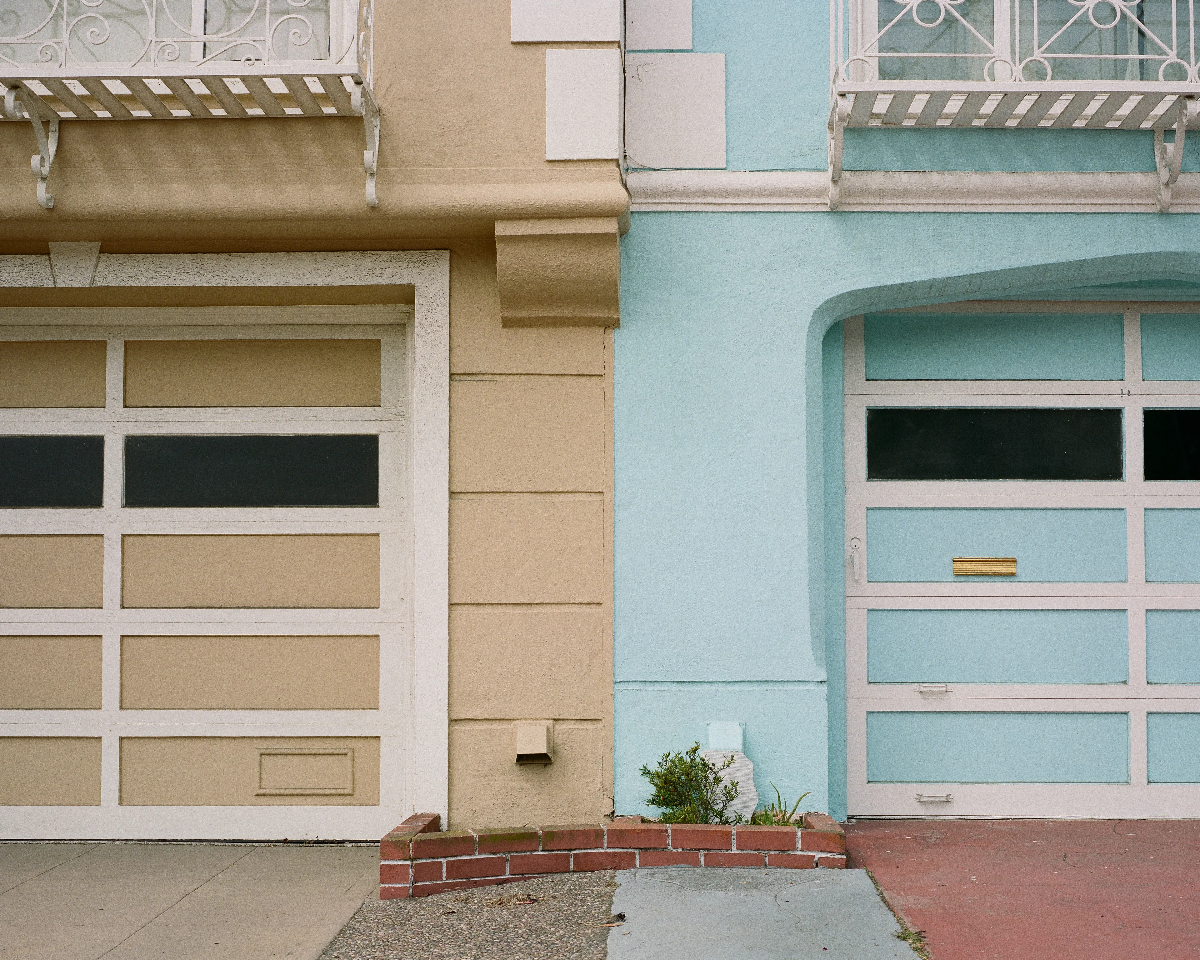 "Outer" is a collection of photographs shot in the Outer Sunset neighborhood of San Francisco, CA. 

Every home in the Outer Sunset has its own unique identity. Although we've likely never met anyone living in these homes, we're able to get a glimpse of their personality through the decorations and color choices of their outer walls.

All photos were shot with a Mamiya 7, using Kodak Portra 400 film stock.