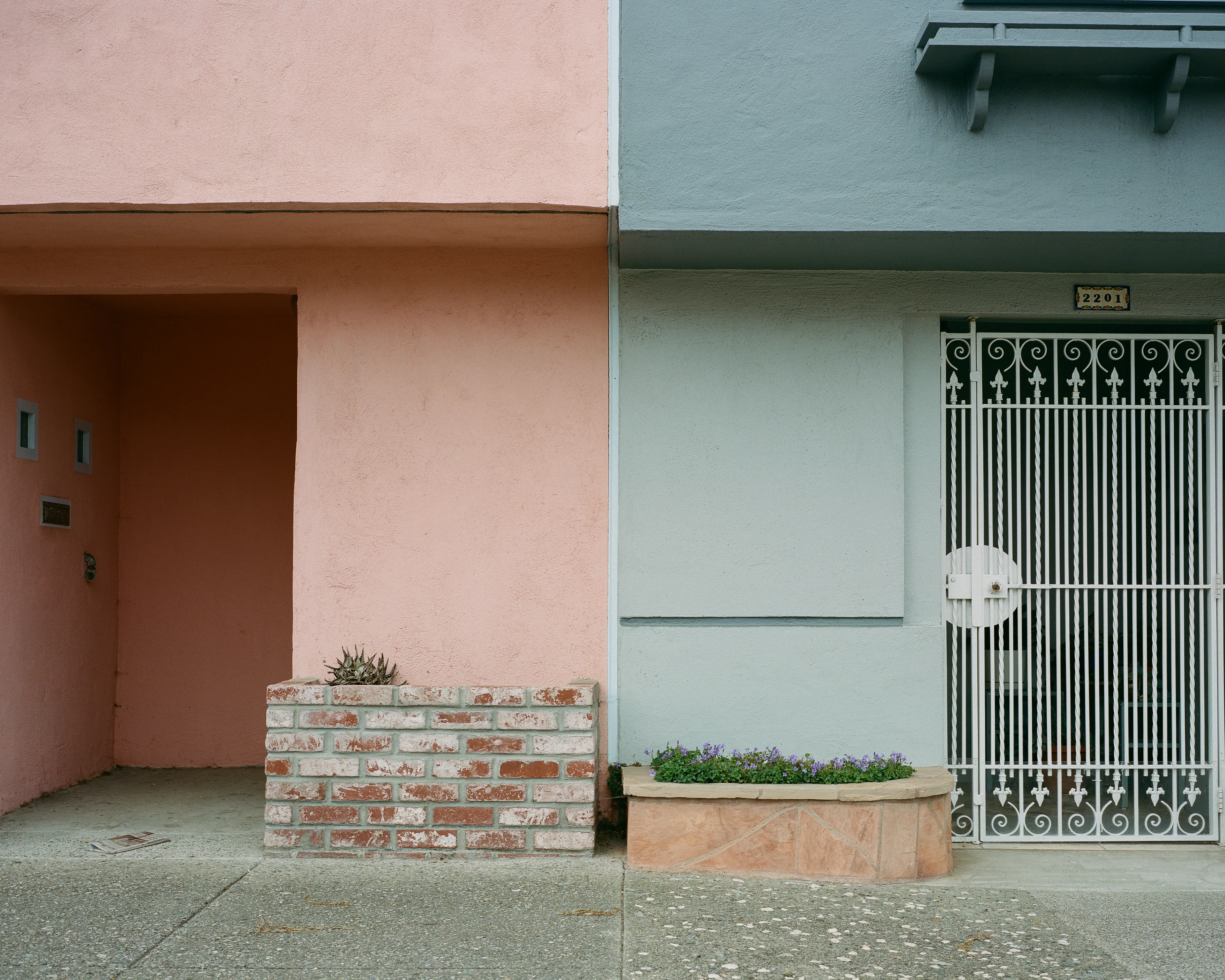"Outer" is a collection of photographs shot in the Outer Sunset neighborhood of San Francisco, CA. 

Every home in the Outer Sunset has its own unique identity. Although we've likely never met anyone living in these homes, we're able to get a glimpse of their personality through the decorations and color choices of their outer walls.

All photos were shot with a Mamiya 7, using Kodak Portra 400 film stock.